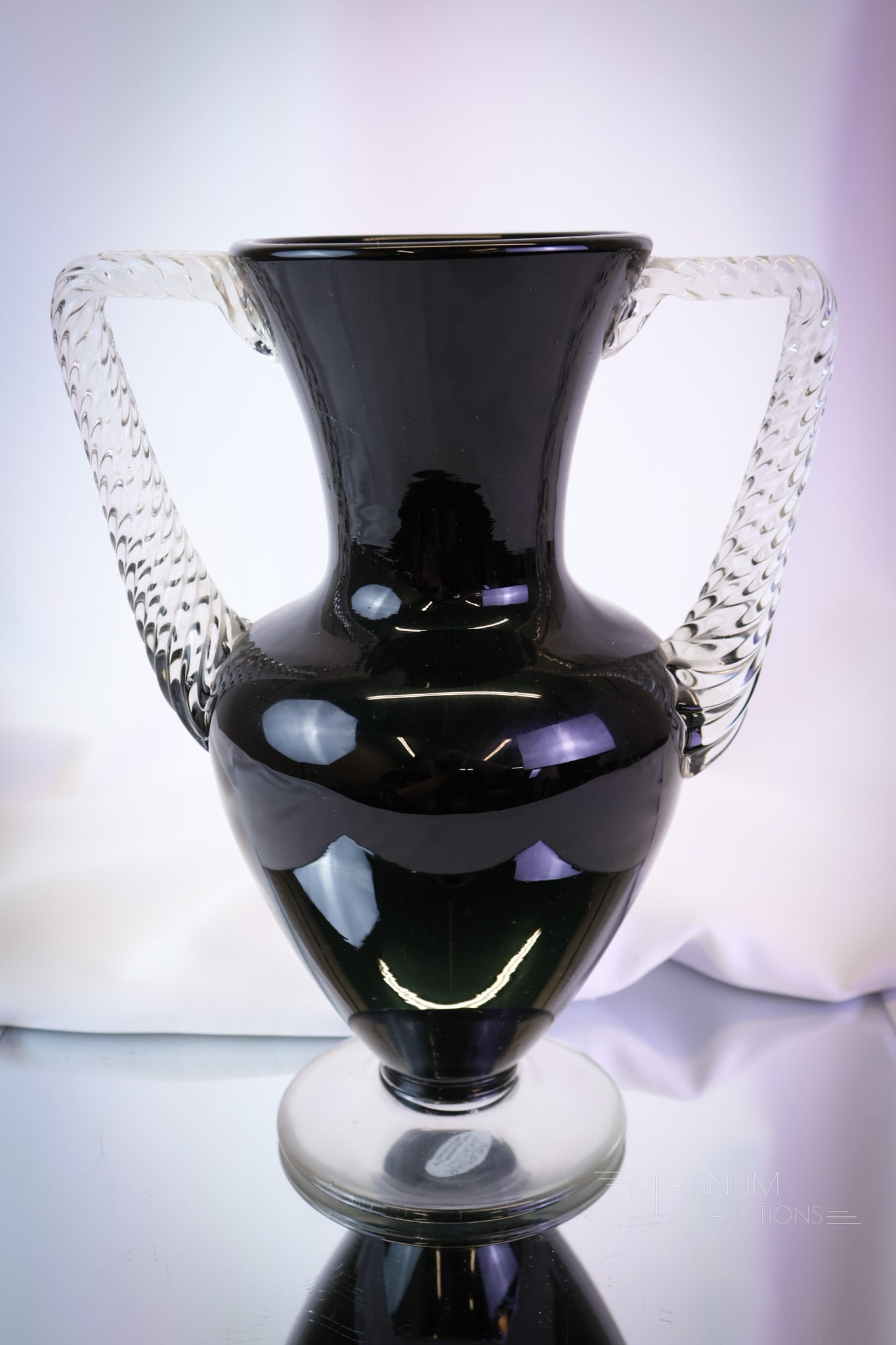 Rare Morgantown "Electra" Art Deco Black Glass Vase: A rare find in Morgantown glass. This Art Deco vase is in the "Electra" pattern in ebony black with two clear twisted handles. The vase measures 10 1/4" tall. SHIPPING NOTICE: If you choose not to uti