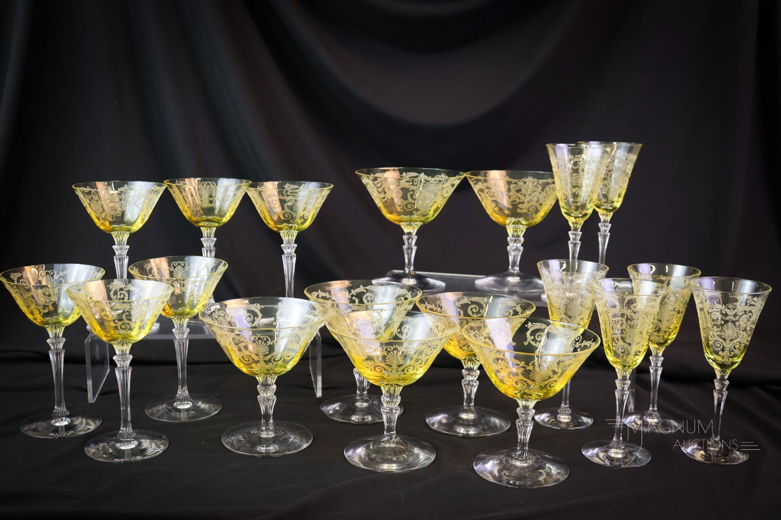 18 pc Lot Fostoria Topaz Versailles Etch Glass Stemware: Eighteen fine finds in Fostoria Topaz "Versailles" etched stemware. This lot includes seven-footed sherberts, six cherry cocktails, and six liquor cocktails. Each is as lovely as the one next to it. T