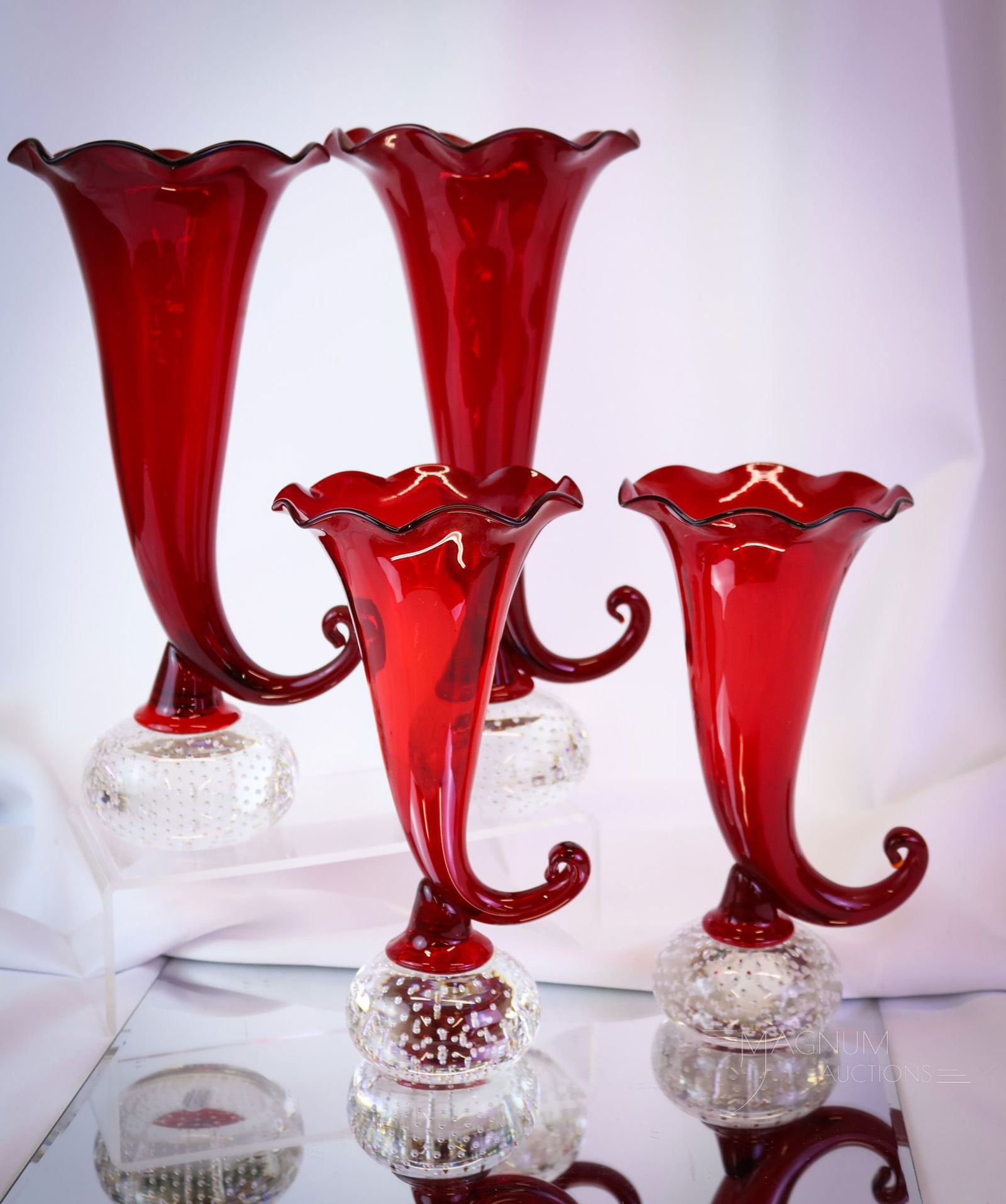 4 pc Lot Pairpoint Ruby Cornucopia Controlled Bubble Art Glass Vases: Two pairs of Pairpoint controlled bubble cornucopia vases are present in this offering. Beautiful ruby coloring. The taller of the two pairs measures 11" high and 5 1/2" wide. Very nice! SHIPPING NOTI