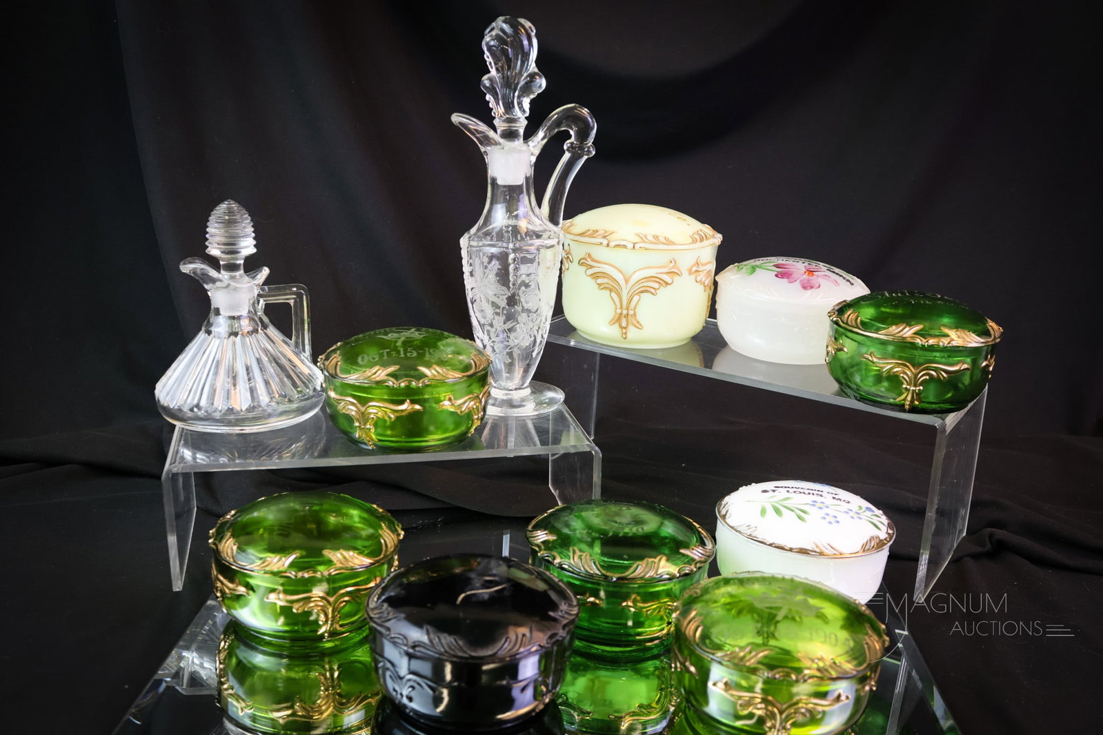 11 pc Lot Heisey: Nine finds in Heisey glass, sure to find a place in a prominent cabinet. This lot includes nine Winged Scroll covered dishes and two clear cruets. The tallest measures 8 1/4". SHIPPING NOTICE: If you 