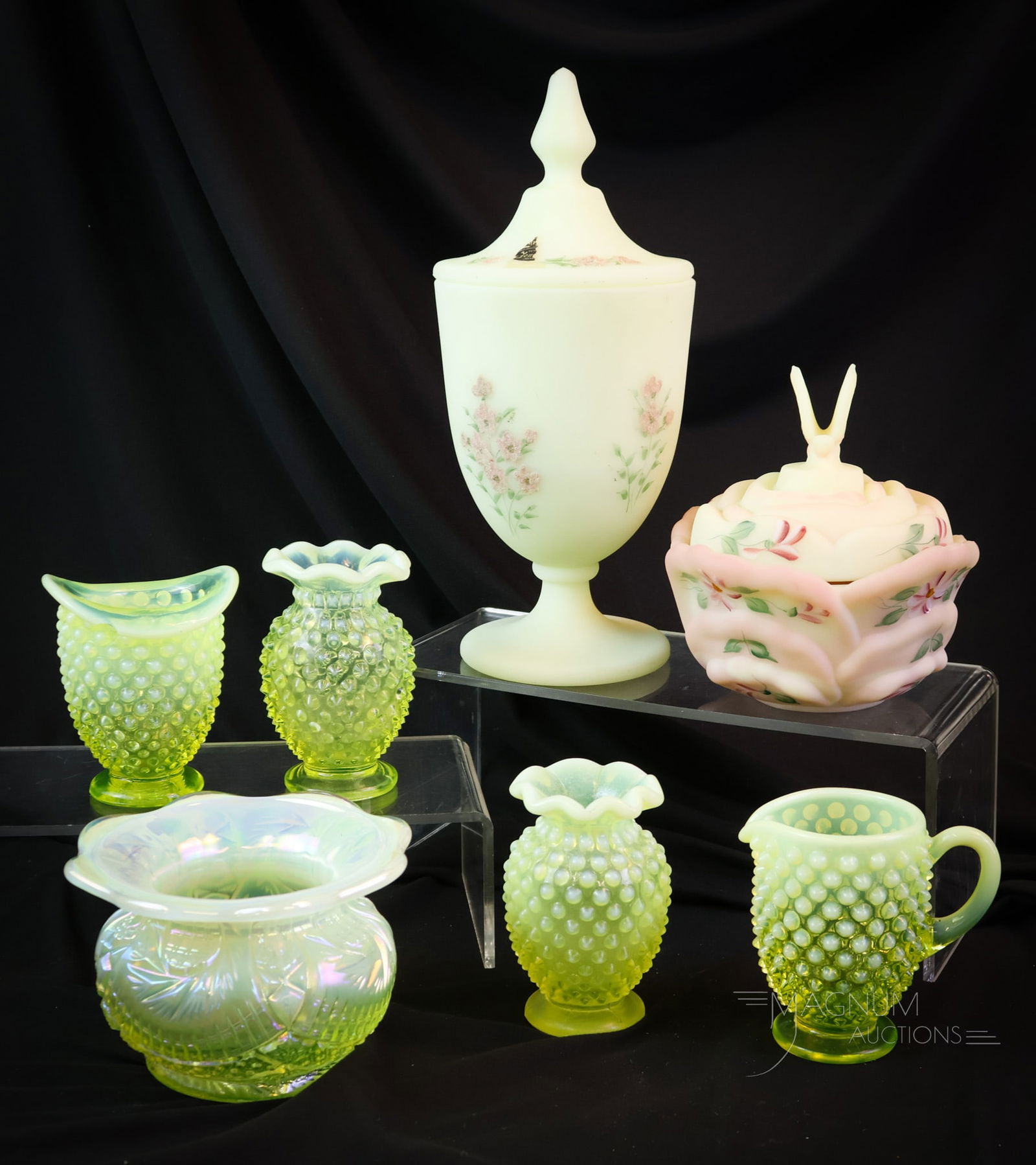 7 pc Lot Fenton Topaz Vaseline Uranium Custard Art Glass: Seven light-up examples of uranium-rich glass to add to your collection. This lot includes four Fenton vaseline hobnail miniature vases. A Fenton Topaz opalescent stripe spitoon. Lastly, there are a c