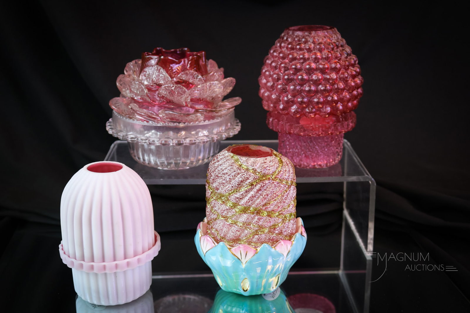4 pc Lot Victorian Glass Fairy Lamps: Four lovelies to add to your fairy lamp collection. The first is a cranberry overshot with a matching base. The second is a cranberry flower-form with clear applied glass petals set on a clear base. T