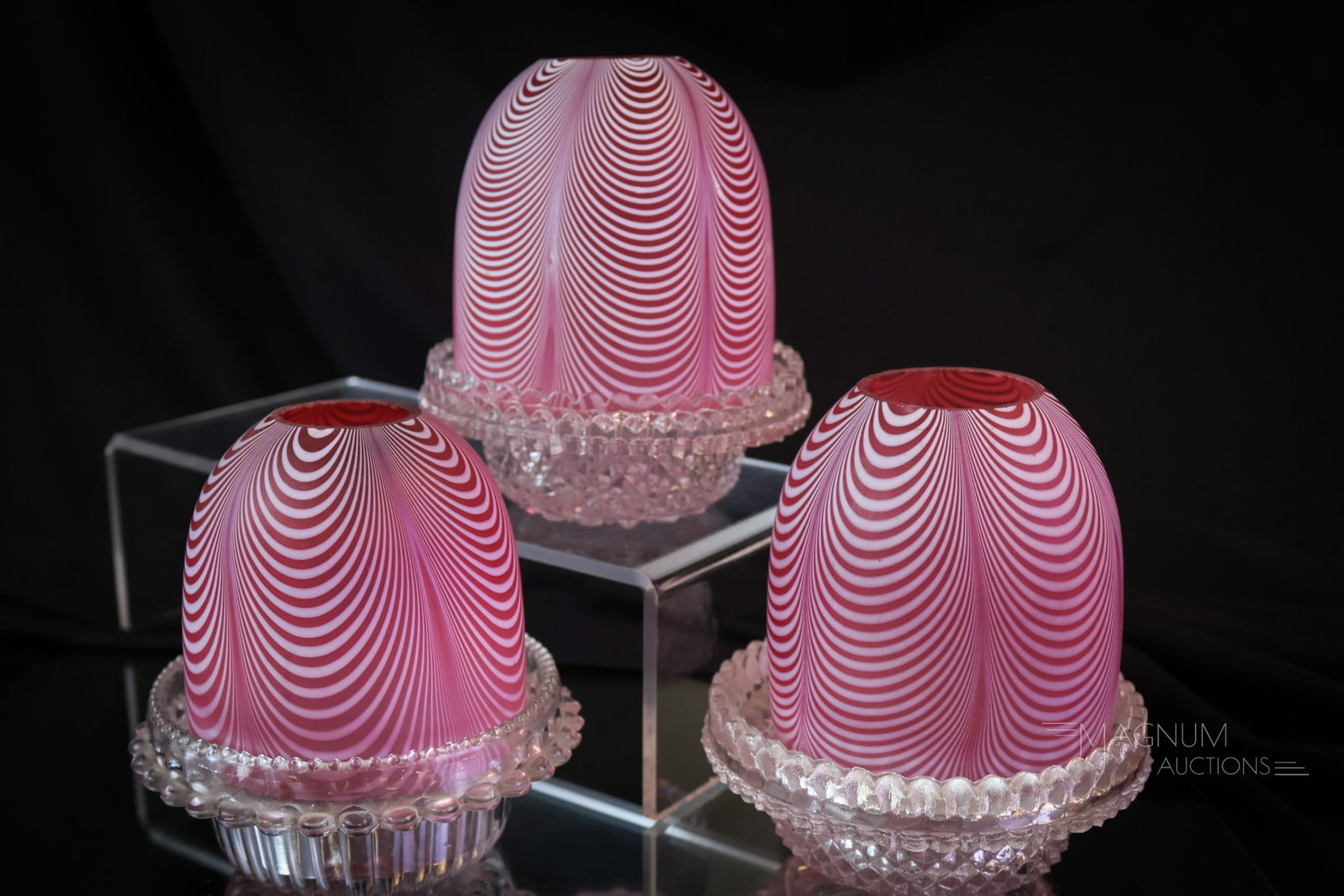 3 pc Lot Victorian Cranberry Nailsea Glass Fairy Lamps: Three super examples of cranberry Nailsea glass Victorian fairy lamps. These are always in demand. Each of these is found with a clear Clarke candle cup. The tallest measures 5". SHIPPING NOTICE: If y