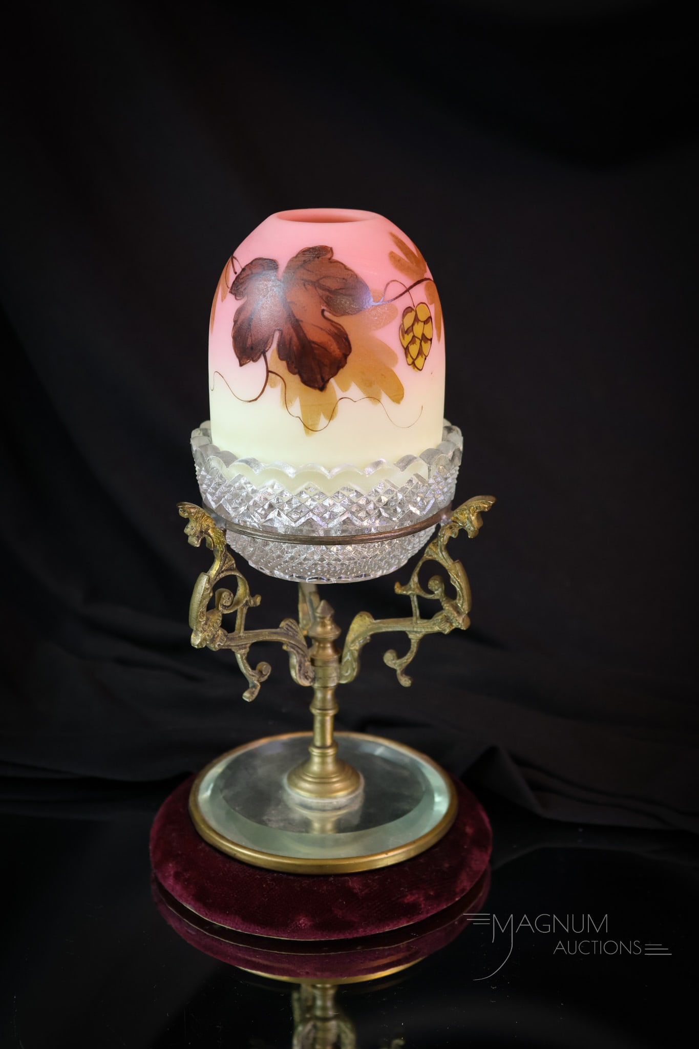 Webb Burmese Victorian Decorated Uranium Glass Mirrored Fairy Lamp: This is a cutie! This fairy lamp is a decorated Webb Burmese example. It sits on a marked Clarke's candle cup and rests on an ormolu stand on a mirrored velvet base. The complete ensemble measures 7 1