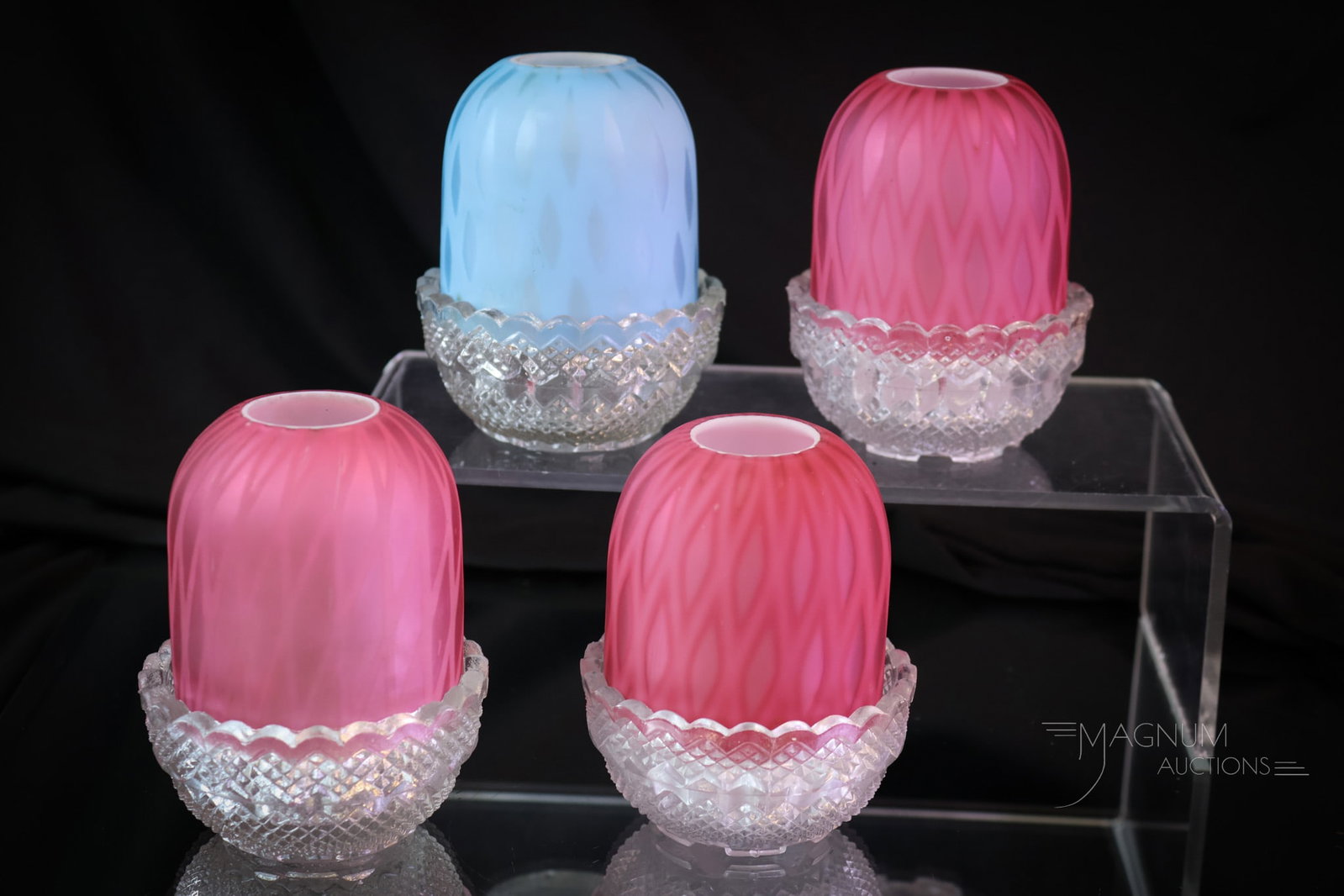 4 pc Lot Victorian Mother of Pearl Satin Glass Fairy lamps: Four fine examples of Victorian diamond-quilt mother-of-pearl glass fairy lamps. Each is on a Clarke's base. There are three pink and one blue. The tallest measures 3 3/4". SHIPPING NOTICE: If you cho