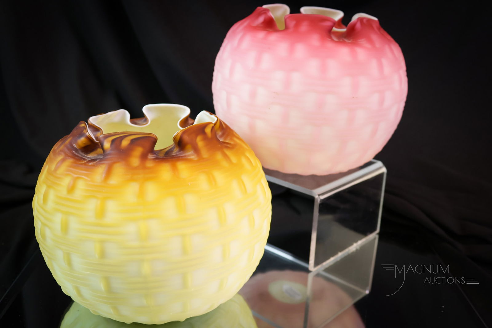 2 pc Lot Stevens & Williams Victorian Glass Basketweave Plated Rose Bowls: Two rare finds in Victorian glass rose bowls in a basketweave pattern, attributed to Stevens & Williams glass. Each of these has a box pleated top rim. One in root beer color. One in pink satin. The l