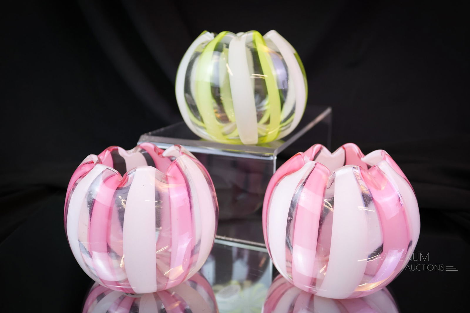 3 pc Lot Stevens & Williams Victorian Glass Ribbon Stripe Rose Bowls: Three lovely examples of Victorian rose bowls. Each is attributed to Stevens & Williams. There is a pair of pink and white ribbon stripe examples, and one with yellow and white stripes. The tallest me