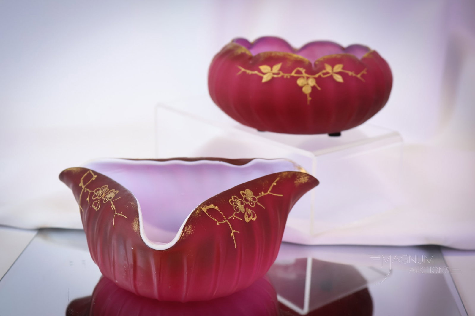 2 pc Lot Rasberry Cased Victorian Gilt decorated Glass Rose Bowl & More: Two unique finds in a similar glass. These pieces are most likely Webb. They are in a deep raspberry-colored glass. Each has beautiful gilt floral decoration. One is a rose bowl. The other is a triang