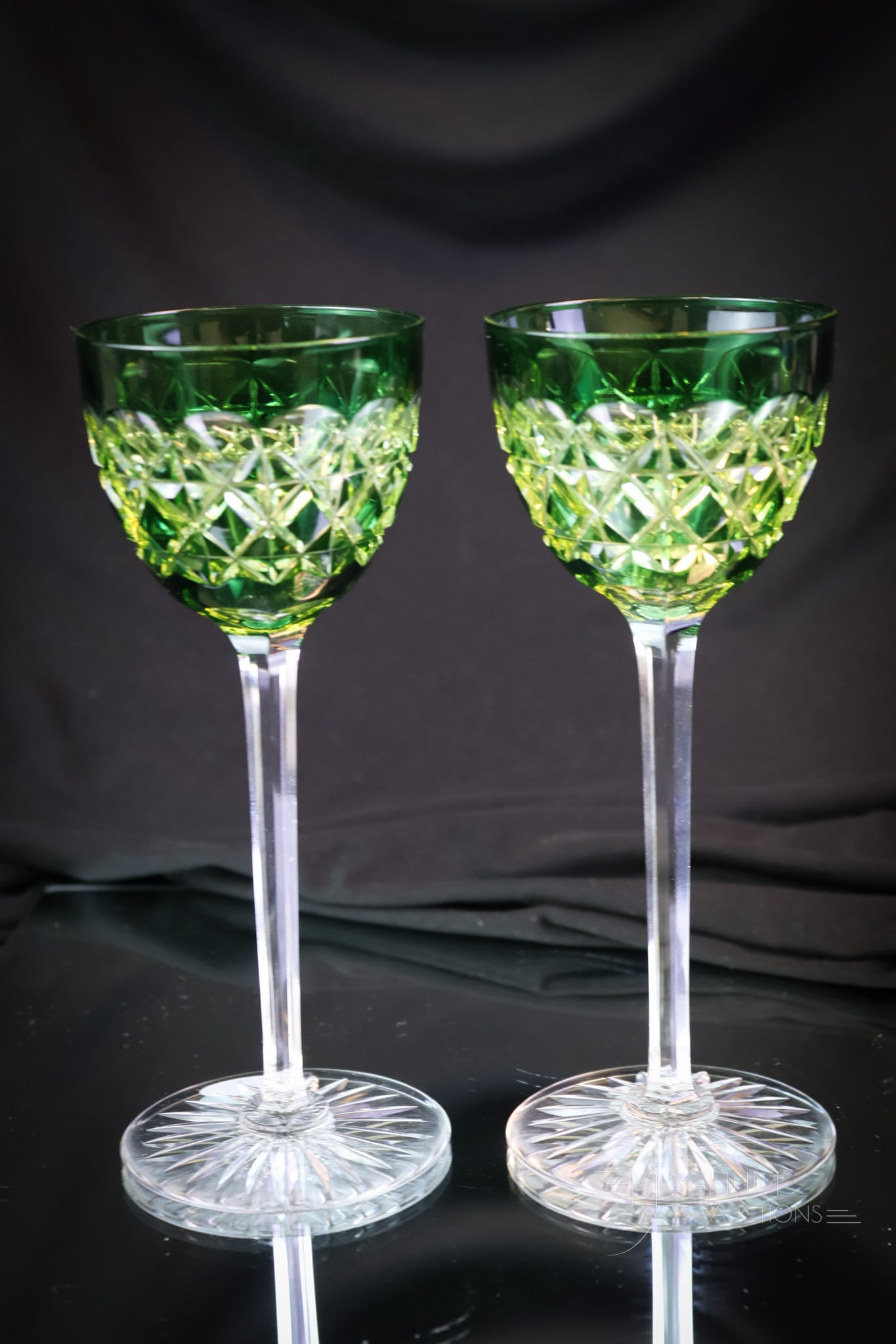 2 pc Lot Val St. Lambert Vaseline Green Cut Glass Stems: Two gorgeous emerald green cut back to vaseline glass stems. Each with attractive cutting. Both are attributed to Val St. Lambert. Each measures 7 1/2" tall and 3" wide. SHIPPING NOTICE: If you choose
