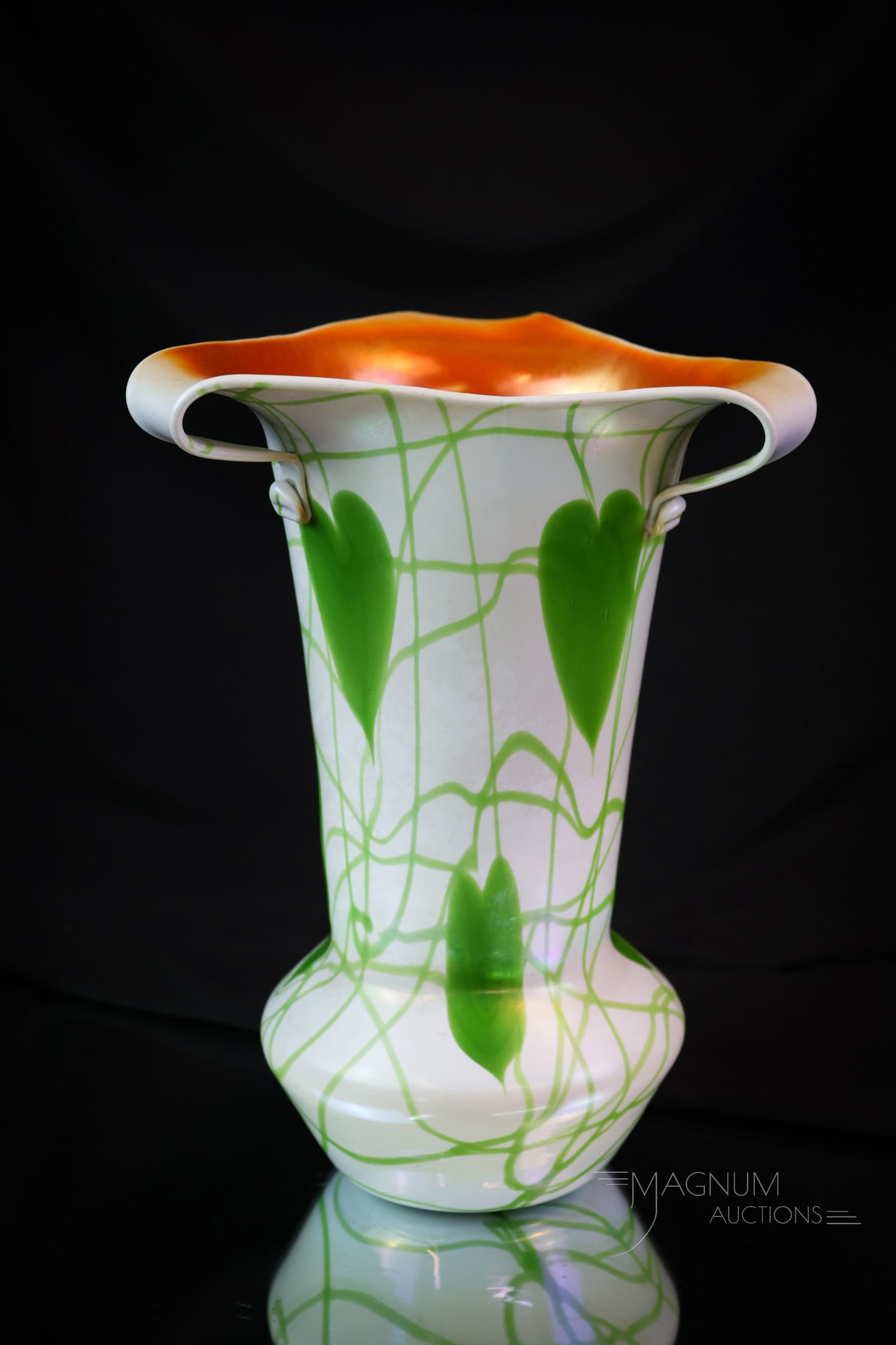 Imperial Freehand White with Green Hearts & Vine Iridized Rabbit Ear Vase: Another attractive find in Imperial freehand glass. This vase is white with green hearts and vine decoration. The vase has an iridescent finish. The top rim has a triple rabbit-ear feature. The interi