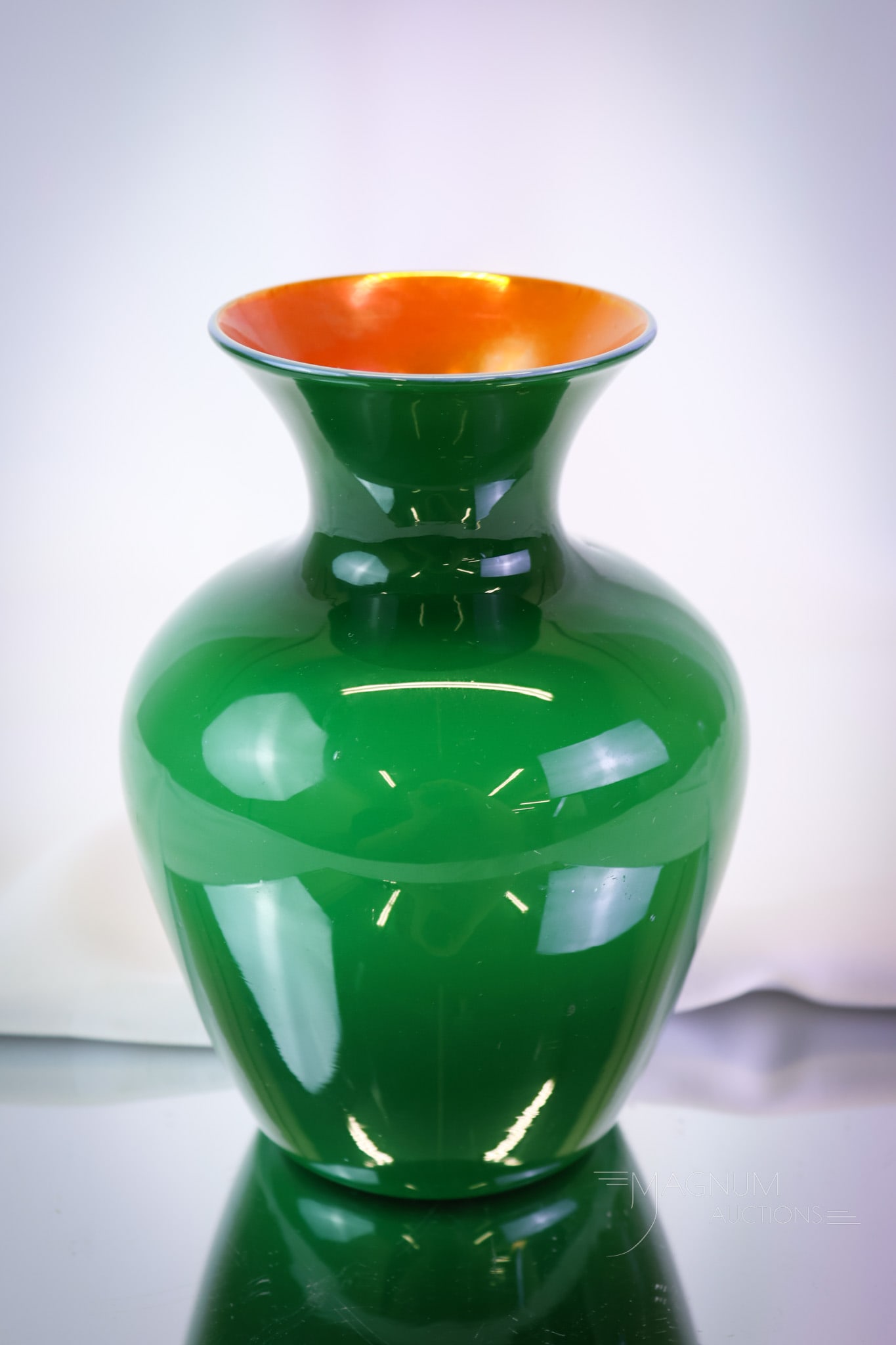 Imperial Freehand Lead Lustre Emerald Green Cased Iridescent Art Glass Vase: The color on this lovely is intense. It is deep emerald green cased with an orange iridescent interior. The vase measures 6" tall and 4 1/4" wide. SHIPPING NOTICE: If you choose not to utilize the Liv