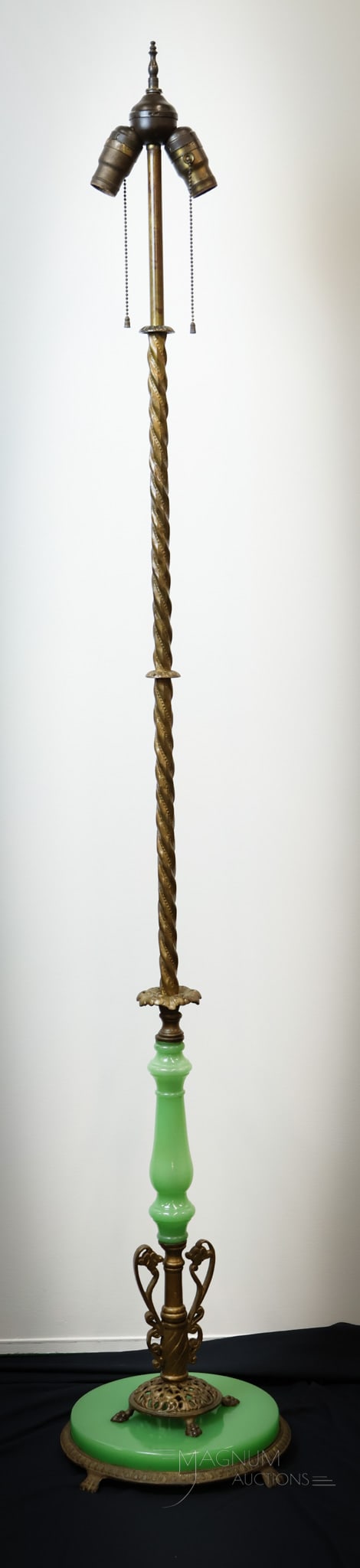 Rare Form Art Deco Jadeite Antique Floor Lamp: A rare design to find a Jadeite Art Décor Floor Lamp in. This beautiful find has a round base with four feet and is accented by a round piece of Jadeite. The lamp post has a twisted metal stem accent