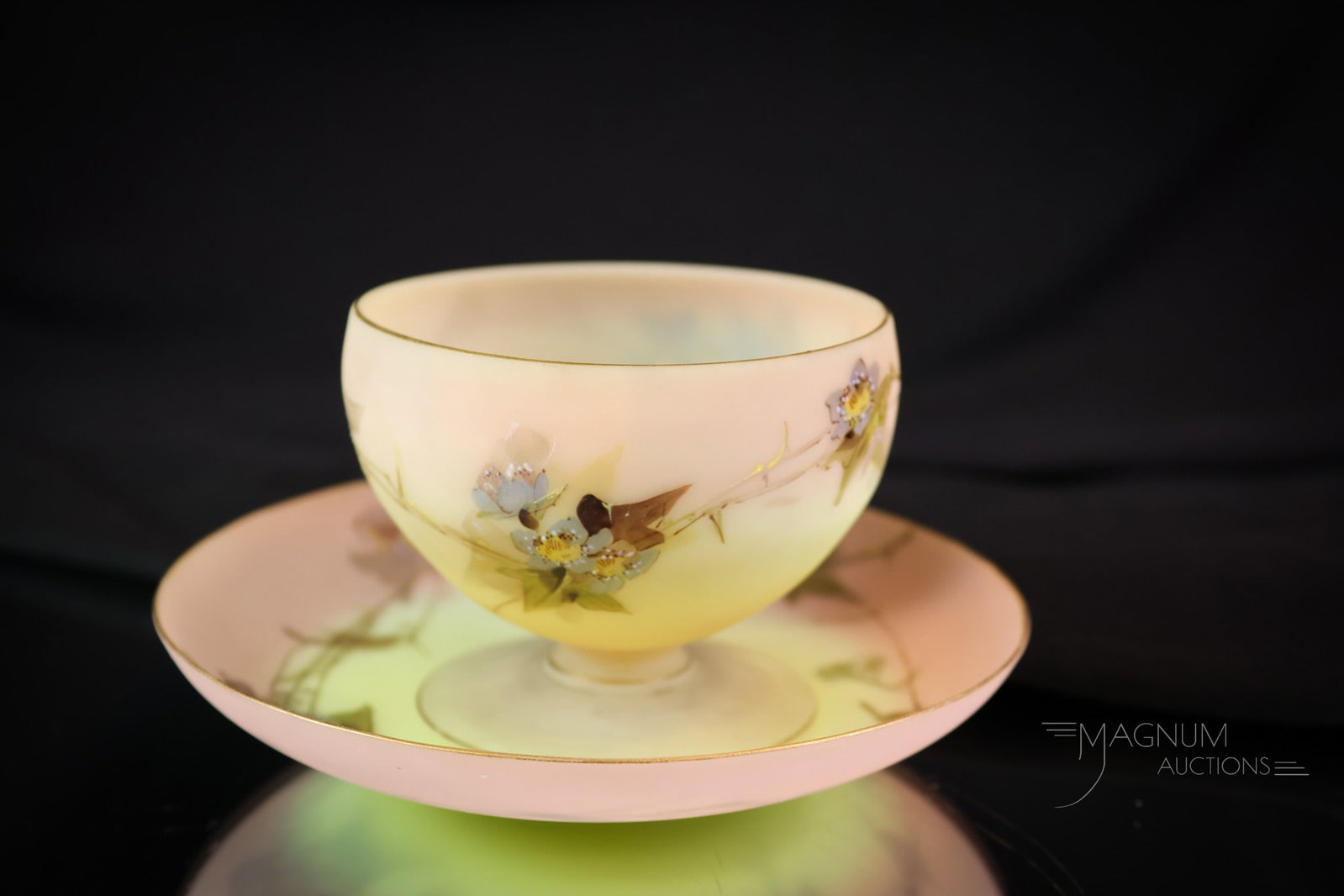 Mt. Washington Uranium Burmese Victorian Art Glass Sherbert & Underplate: A perfect piece of Mt. Washington decorated uranium-rich burmese art glass. This sherbert and matching underplate are prolifically decorated with Hawthorne flowers and foliage. This delicate piece is 