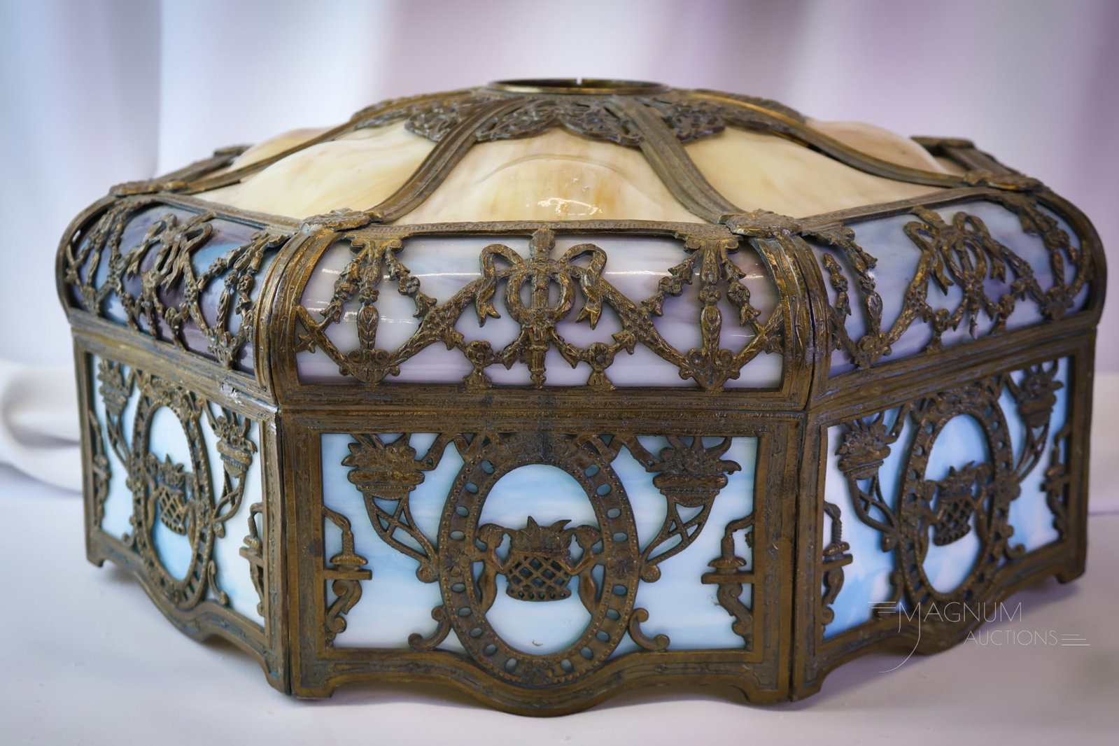 Empire Lamp Co. Bent Slag Panel Overlay Antique Table Lamp Shade: What a beautiful shade this is! This antique bent panel slag glass shade has an ornate filigree overlay. There are three colors of slag glass in this marvelous example. The shade has caramel, lavender