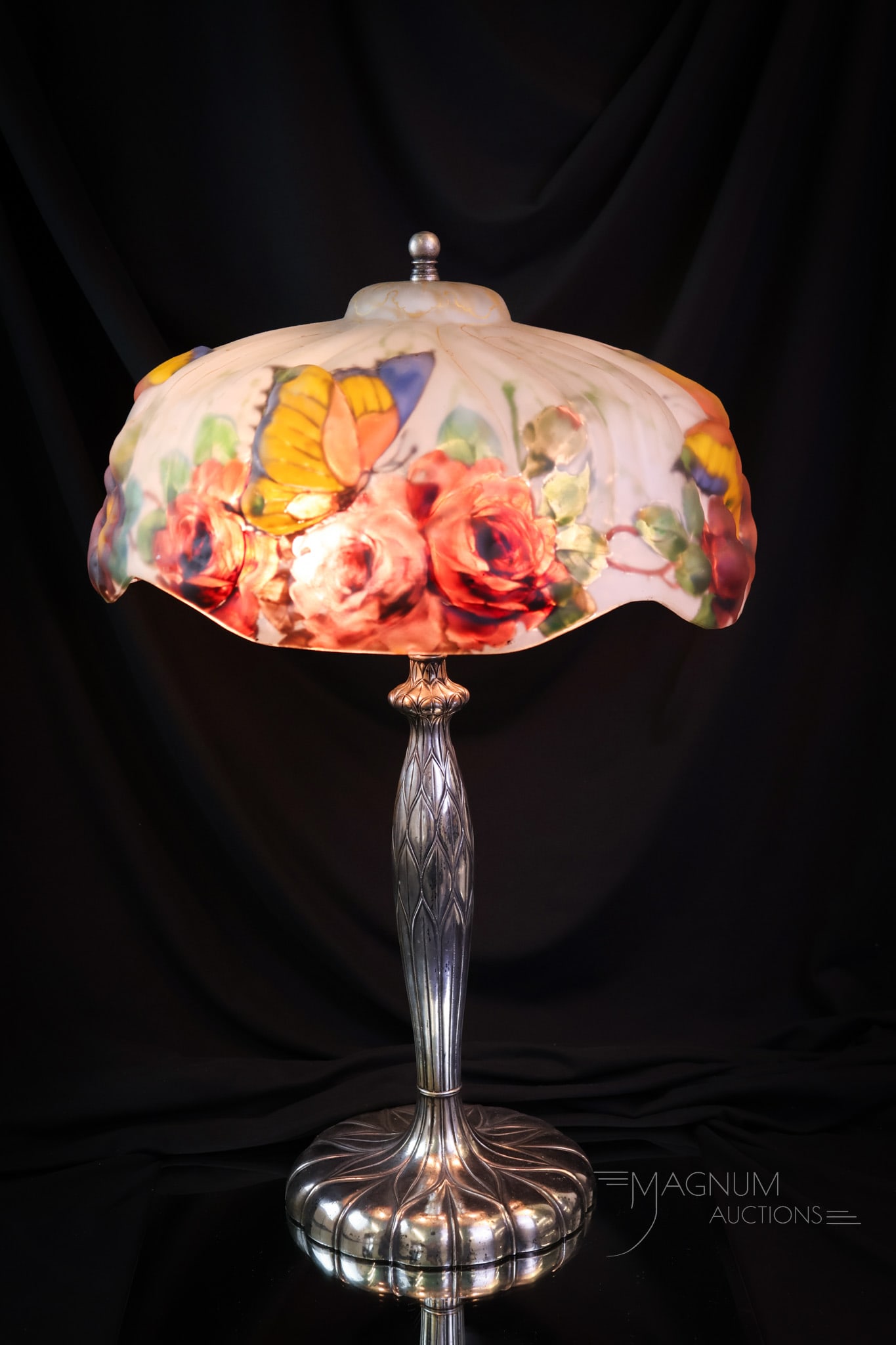 Pairpoint Puffy "Papillon" Reverse Painted Table Lamp: A beautiful lamp on any day. This is a signed shade and base Pairpoint puffy Papillon pattern table lamp. This lamp has bright, colorful butterflies dancing around roses on a variegated, white backgro