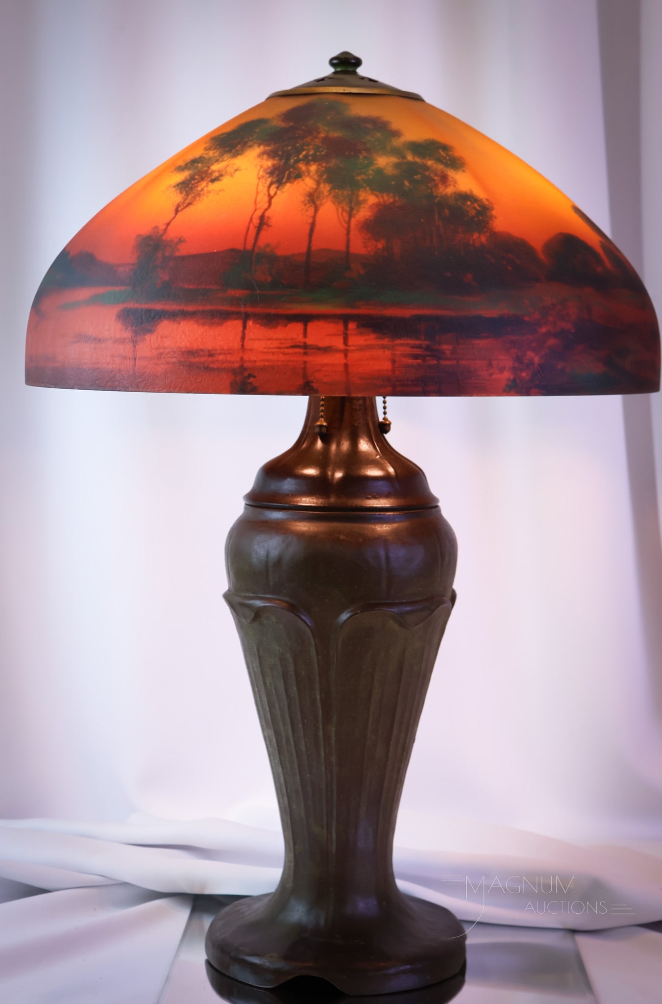 Arts & Crafts Era Handel "7104" Reverse Painted 27" Table Lamp: A magnificent, signed shade and base Handel table lamp. This Arts & Crafts period-appropriate table lamp features a fiery reverse-painted shade in vivid orange to red coloring with a scenic decoration