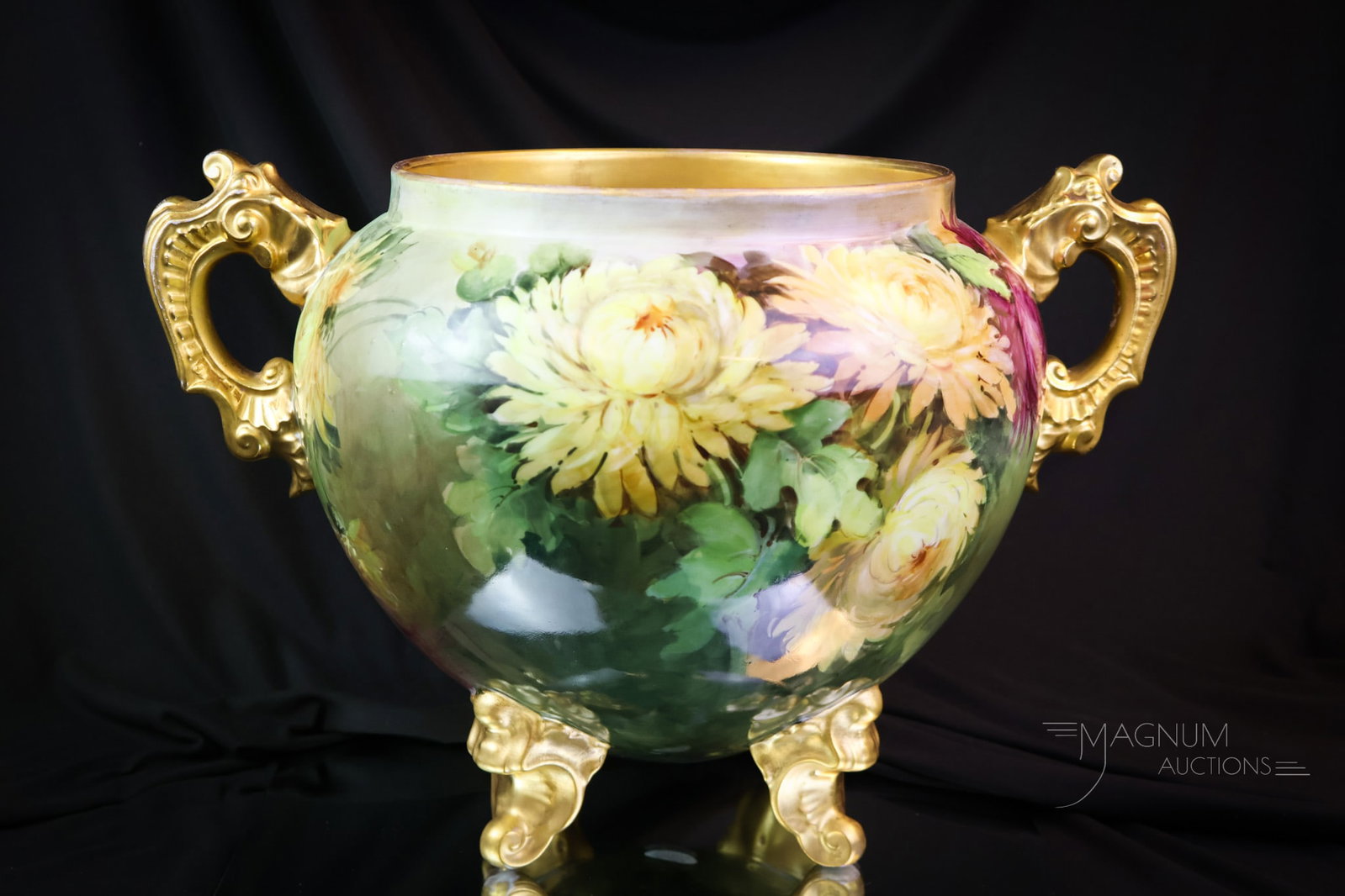 Huge Unmarked Limoges Hand Painted Porcelain Jardinere: A fine piece of hand piated porcelain. This is an unmarked Limoges blank. It is decorated with colorful chrysanthemums. It features gilt handles and four feet. A grand piece for any collection. The ja