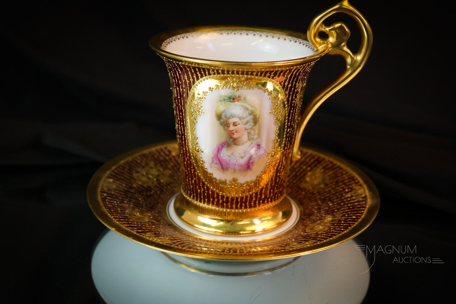 Dresden Hand Painted Portrait Porcelain Cup & Saucer: A fine piece of hand-painted Dresden porcelain. This piece is hand-detailed with gilt decoration and bears a portrait of a lovely woman. The ensemble measures 4 1/4" tall. SHIPPING NOTICE: If you choo