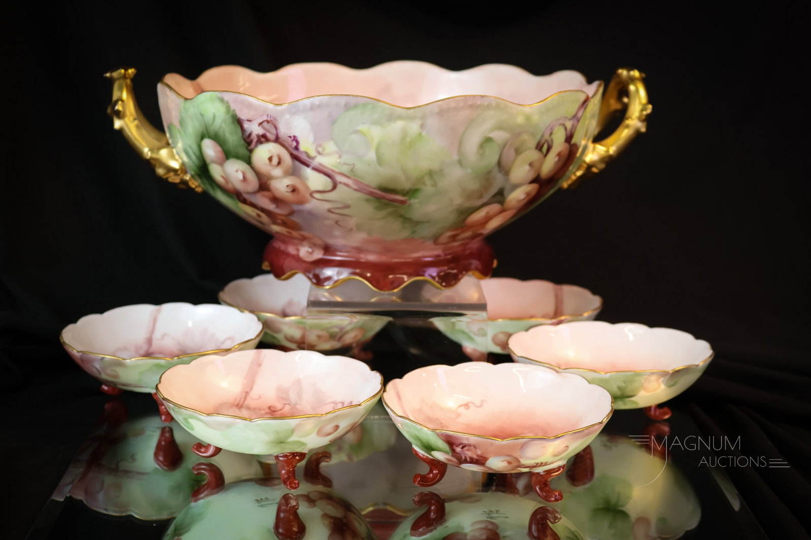 7 pc Hand Painted Porcelain Limoges Bavaria Grapes & Gold Berry Set: A beautiful fid in hand-painted porcelain. This is a complete seven-piece berry set. The master bowl features twig-form handles. The pieces of the set are embellished with gold and grapes. The master 