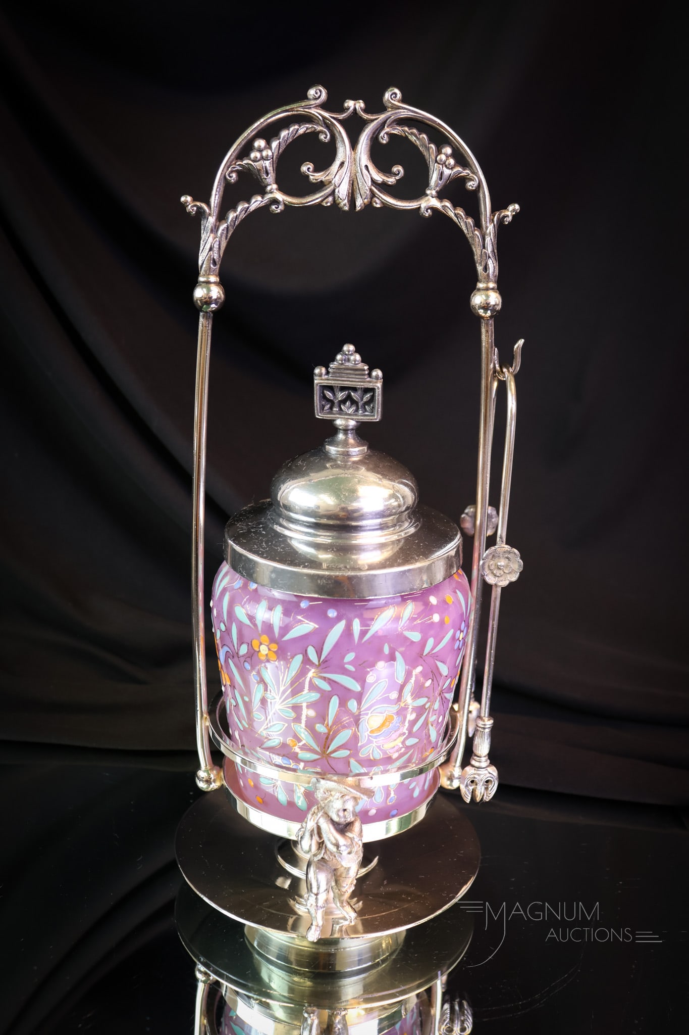 Meriden Figural Silverplate Victorian Lavender Enameled Glass Pickle Castor: A wonderful and rare find in a Victorian silverplate pickle castor. This castor features two Victorian lads on either side of the base. The frame is signed Meriden. It holds a lavender-cased, enameled