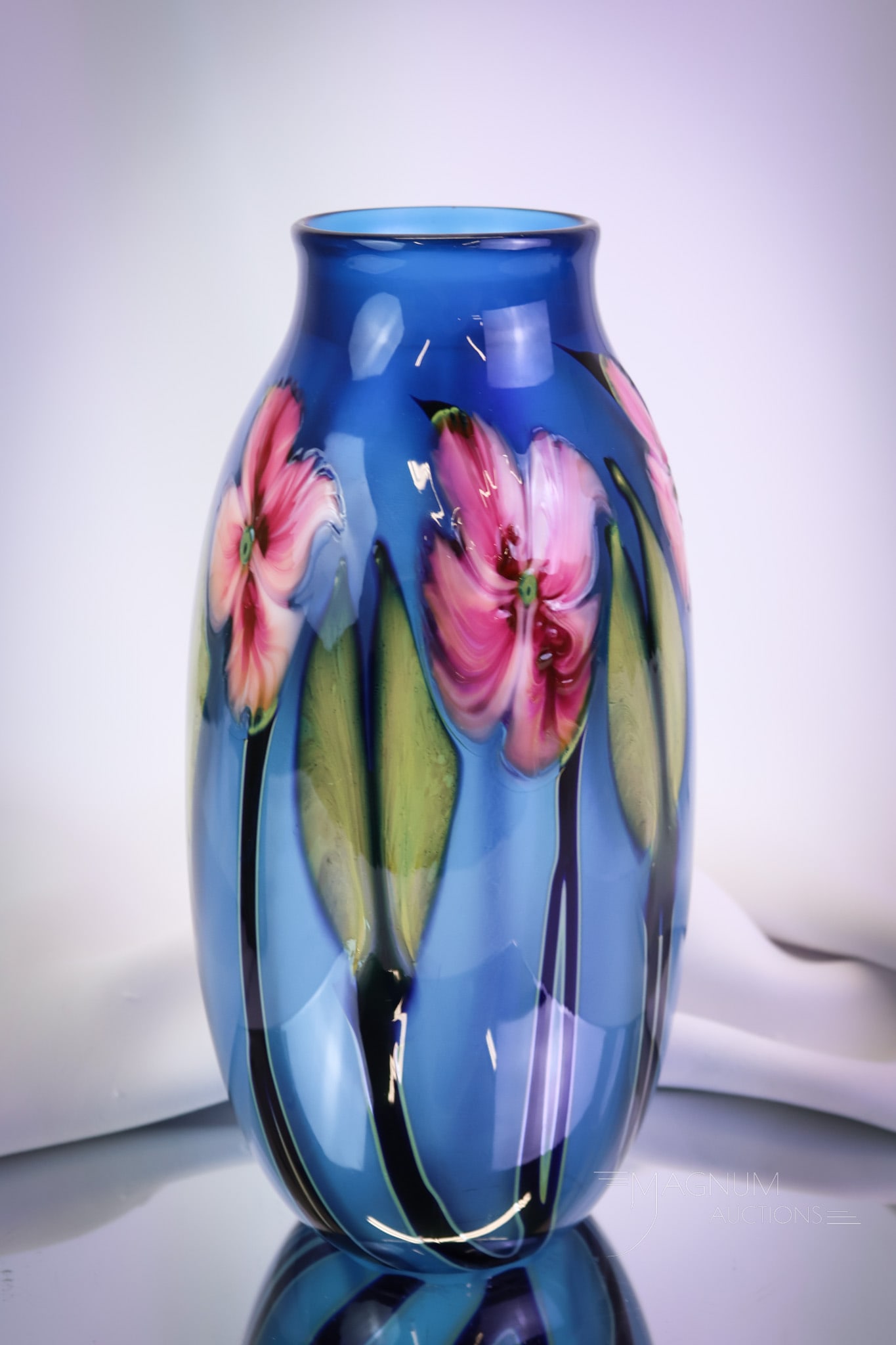 Charles Lotton 1989 Multiflora Art Glass Vase: A signed Charles Lotton art glass vase. This fine piece of art glass is dated 1989. This vase is a multiflora example in blue with bright pink flowers. The piece stands 9 1/2" tall. SHIPPING NOTICE: I