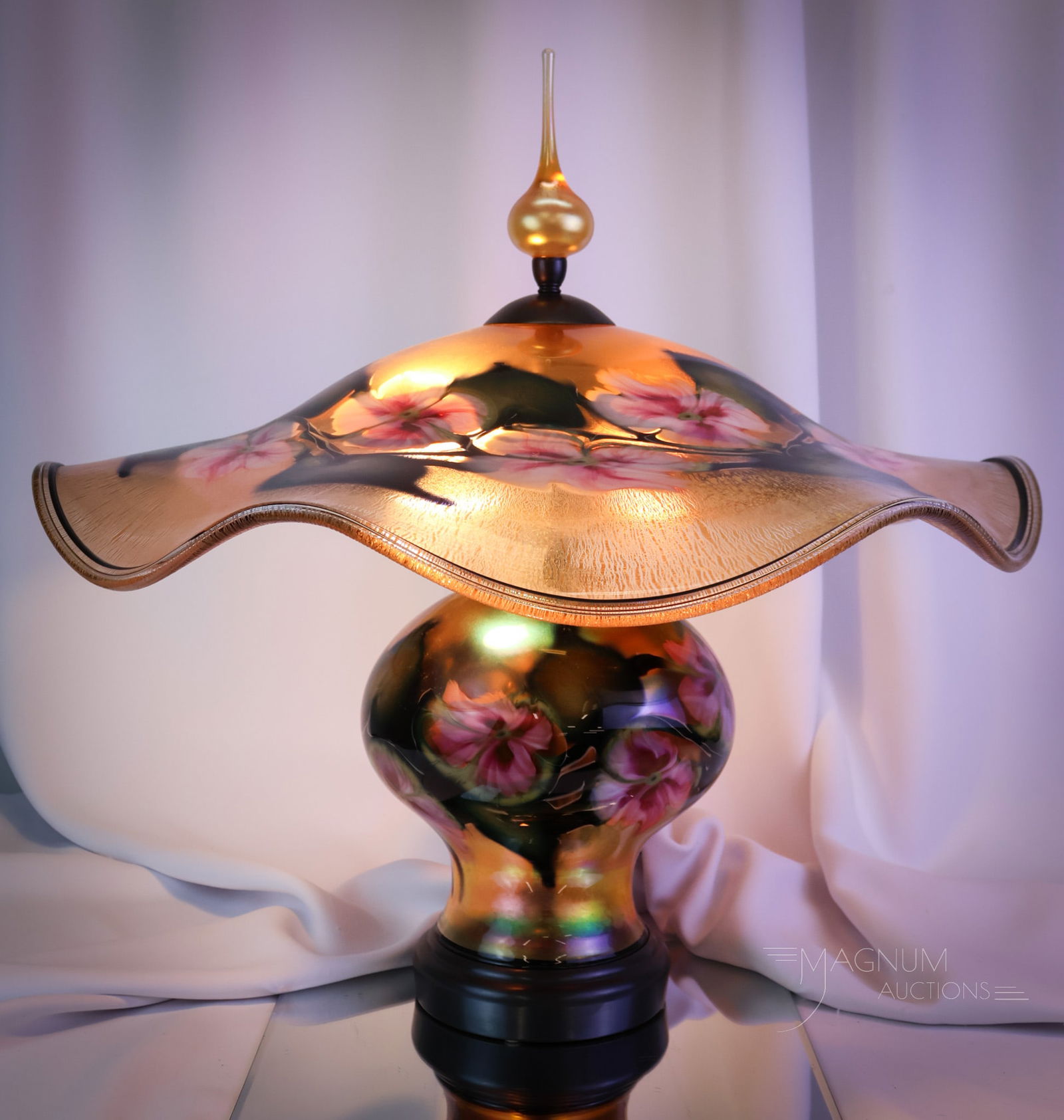 Signed Charles Lotton 1999 Multiflora Art Glass Table lamp: A fabulous example of a Charles Lotton Table Lamp. This piece is dated 1999. It features gold iridescent coloring with pink flowers. The glass has a stretch onion-skin effect. The lamp is complete wit