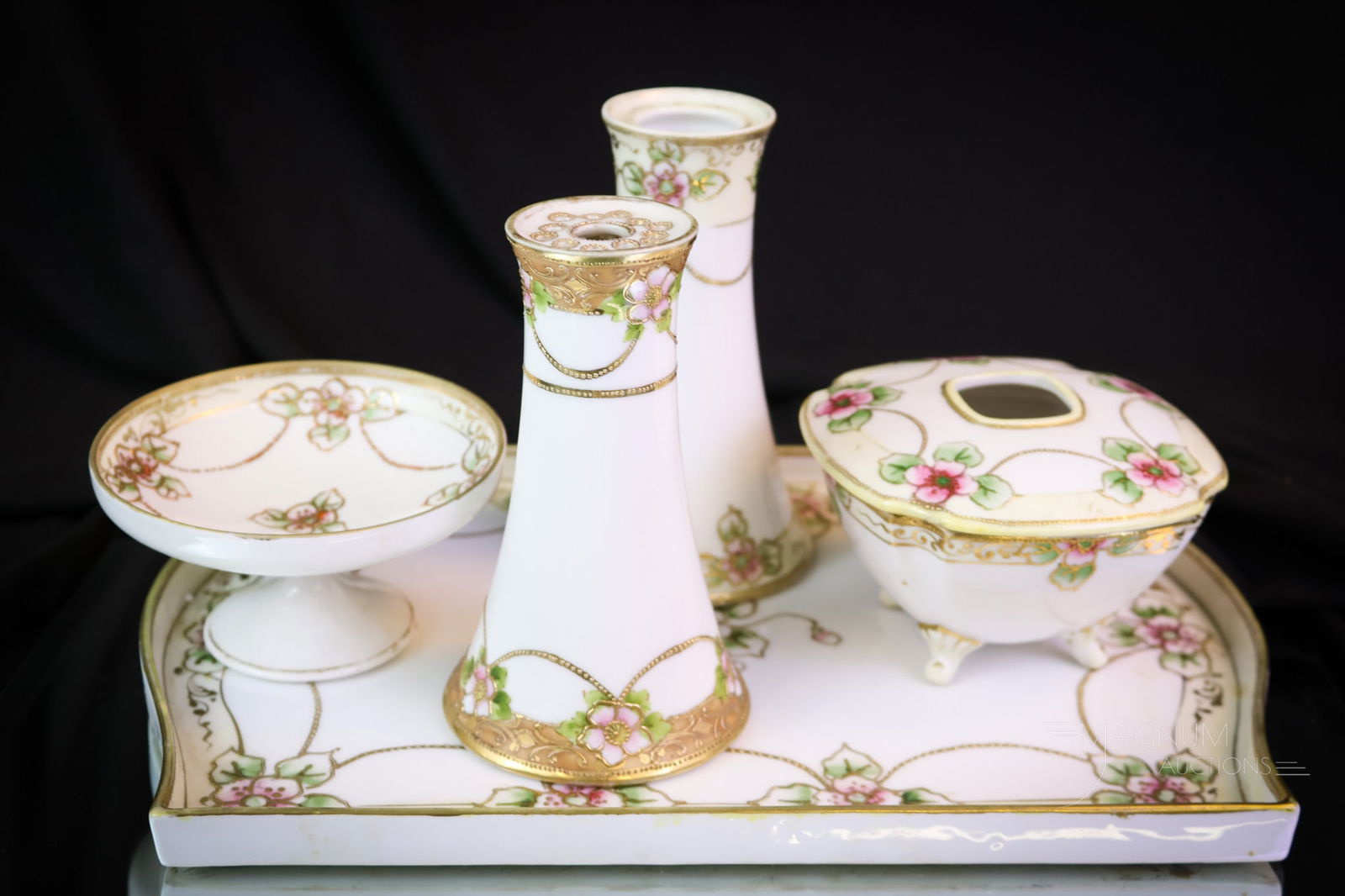 5 pc Nippon Green Mark Porcelain Vanity Dresser set: A fine offering of a Nippon green mark vanity dresser set. This eloquently decorated set is a lovely example of antique porcelain. Will you be the new owner? The tallest measures 6". SHIPPING NOTICE: