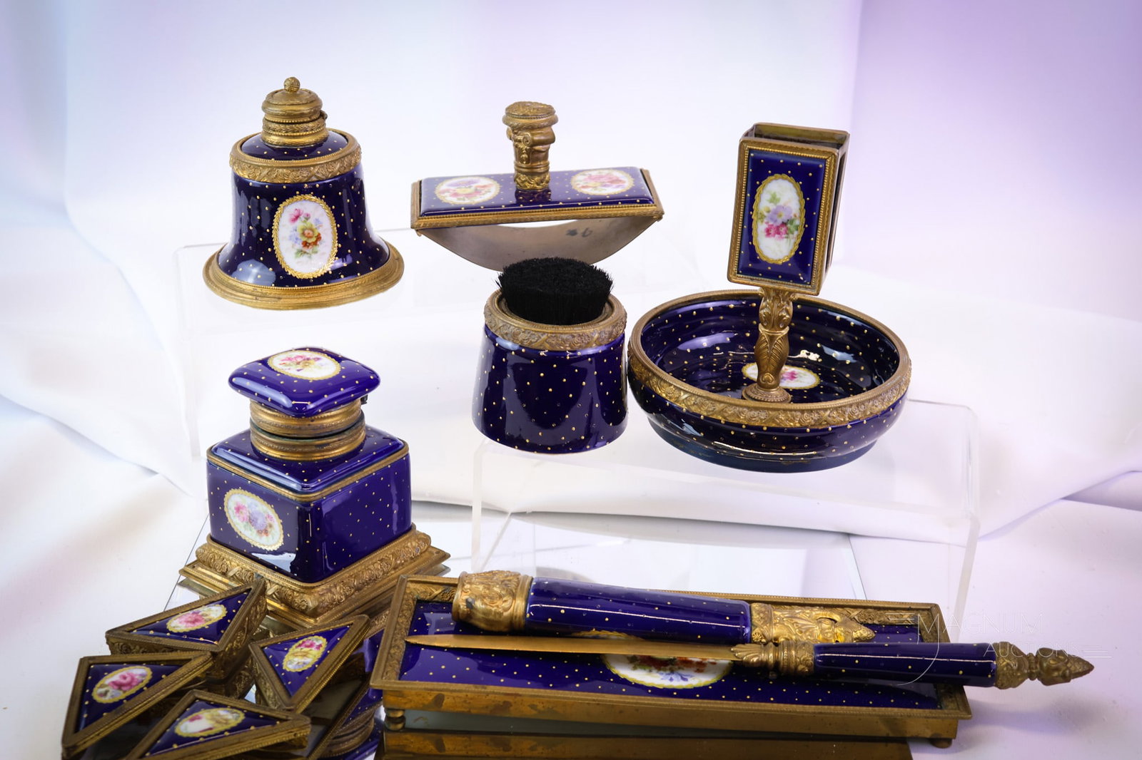 12 pc Sevres Cobalt & Gold Porcelain Desk Set: A wonderful find in decorated cobalt and gold Sevres porcelain. This is a desk set. It features decorations of floral medallions. The set includes items such as an inkwell, blotter, tray, pen wipe, ma
