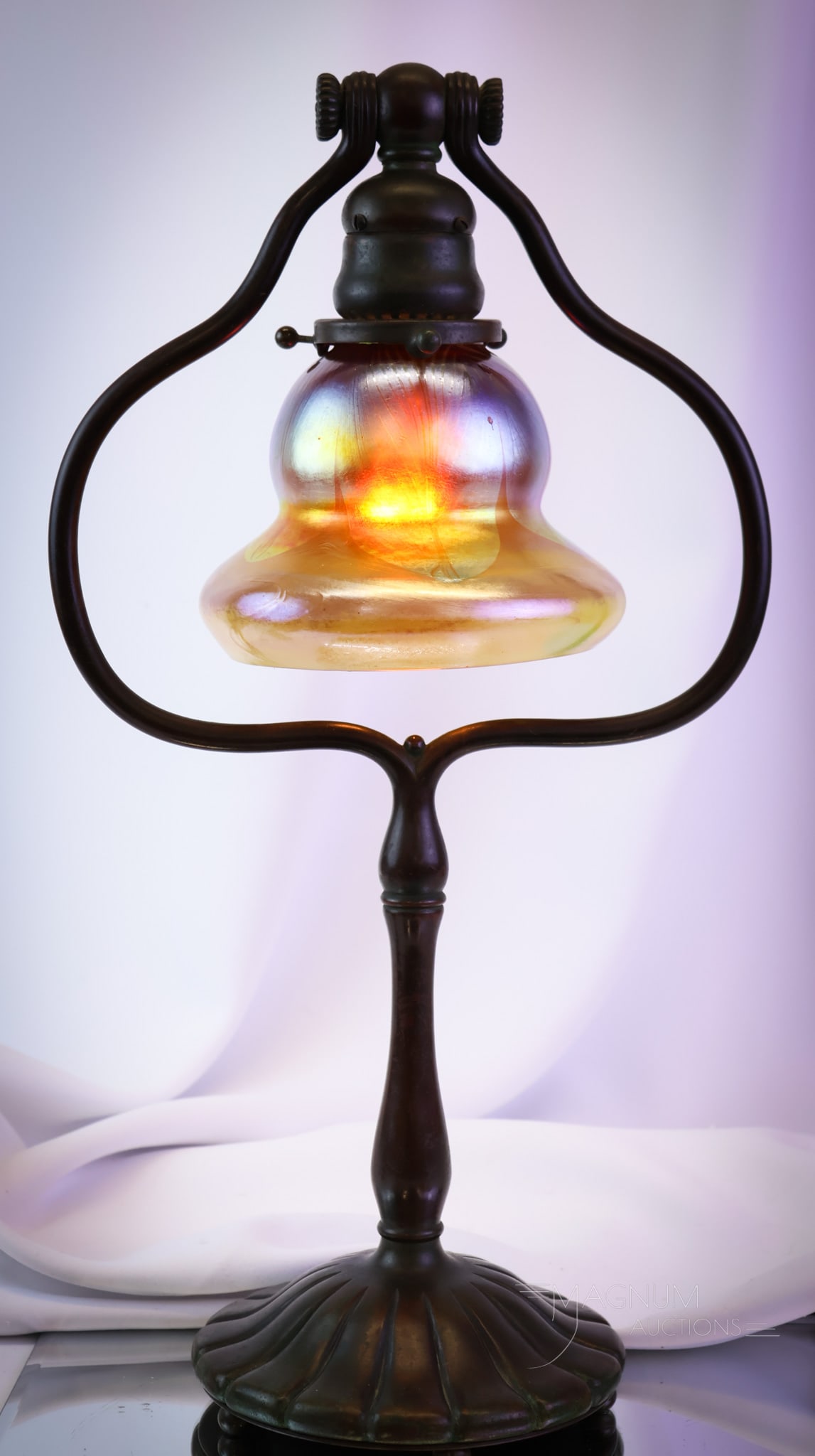 Tiffany Studios Bronze L.C.T. Favrile Pulled Feather Desk Lamp: A wonderful find in original condition. This is a Tiffany Studios bronze desk lamp. The lamp features a signed "L.C.T." Favrile pulled feather art glass shade. The lamp features original patina and ha