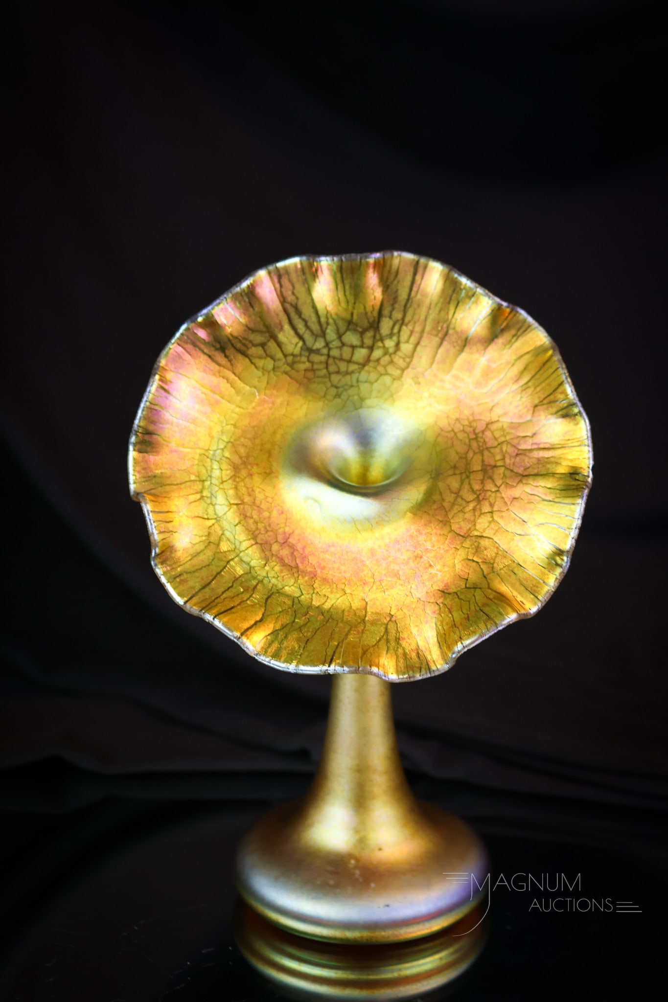 6" Steuben Gold Aurene Diminutive Jack in the Pulpit Vase: A very rare find in Steuben gold Aurene. This is a little 6" tall and 4" wide Jack in the Pulpit Vase. It has gorgeous iridescent color and is quite striking. It has an onion skin effect on the glass.