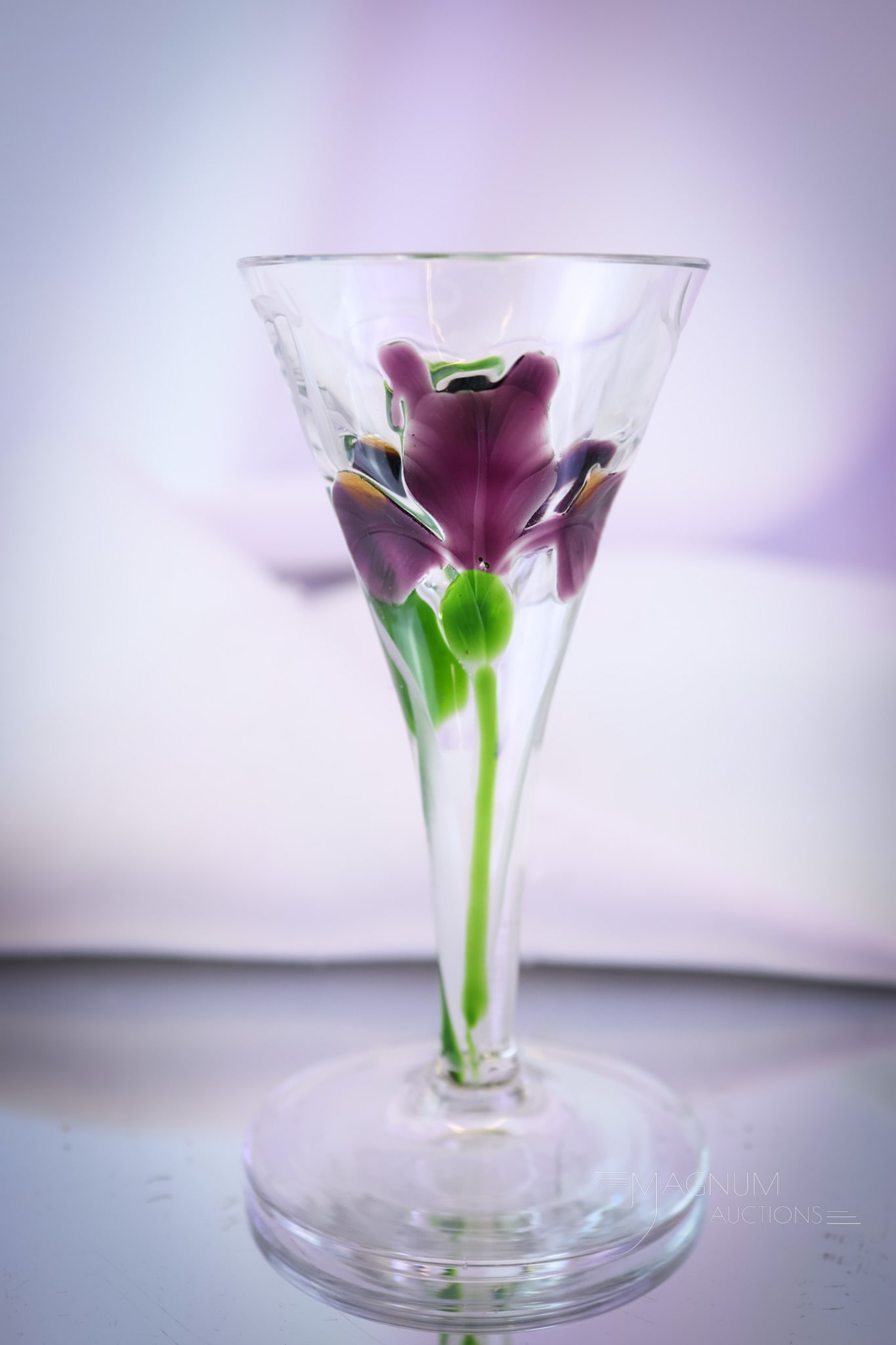 Moser Marquetry Intaglio Cut Purple Iris Cordial Stem: A charming find in Moser marquetry intaglio cut glass. This piece is decorated with purple iris flowers. It measures 3 3/4" tall. SHIPPING NOTICE: If you choose not to utilize the LiveAuctioneers Live