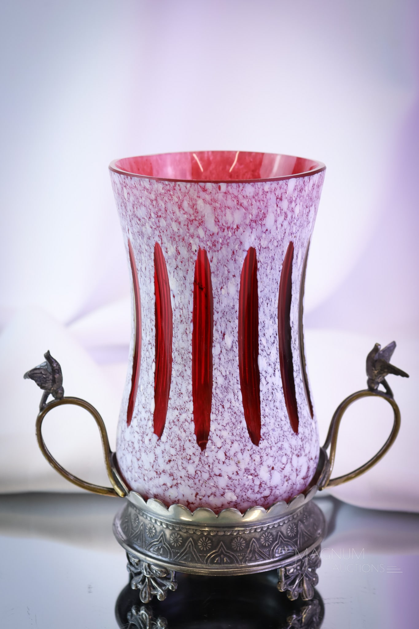Rockford Silverplate Victorian Cranberry Cutback Glass Celery Vase: A fine find in Victorian art glass and silverplate. This is a celery vase set in a signed Rockford silverplate holder. The holder is adorned with brids on the handles. The celery vase is attributed to