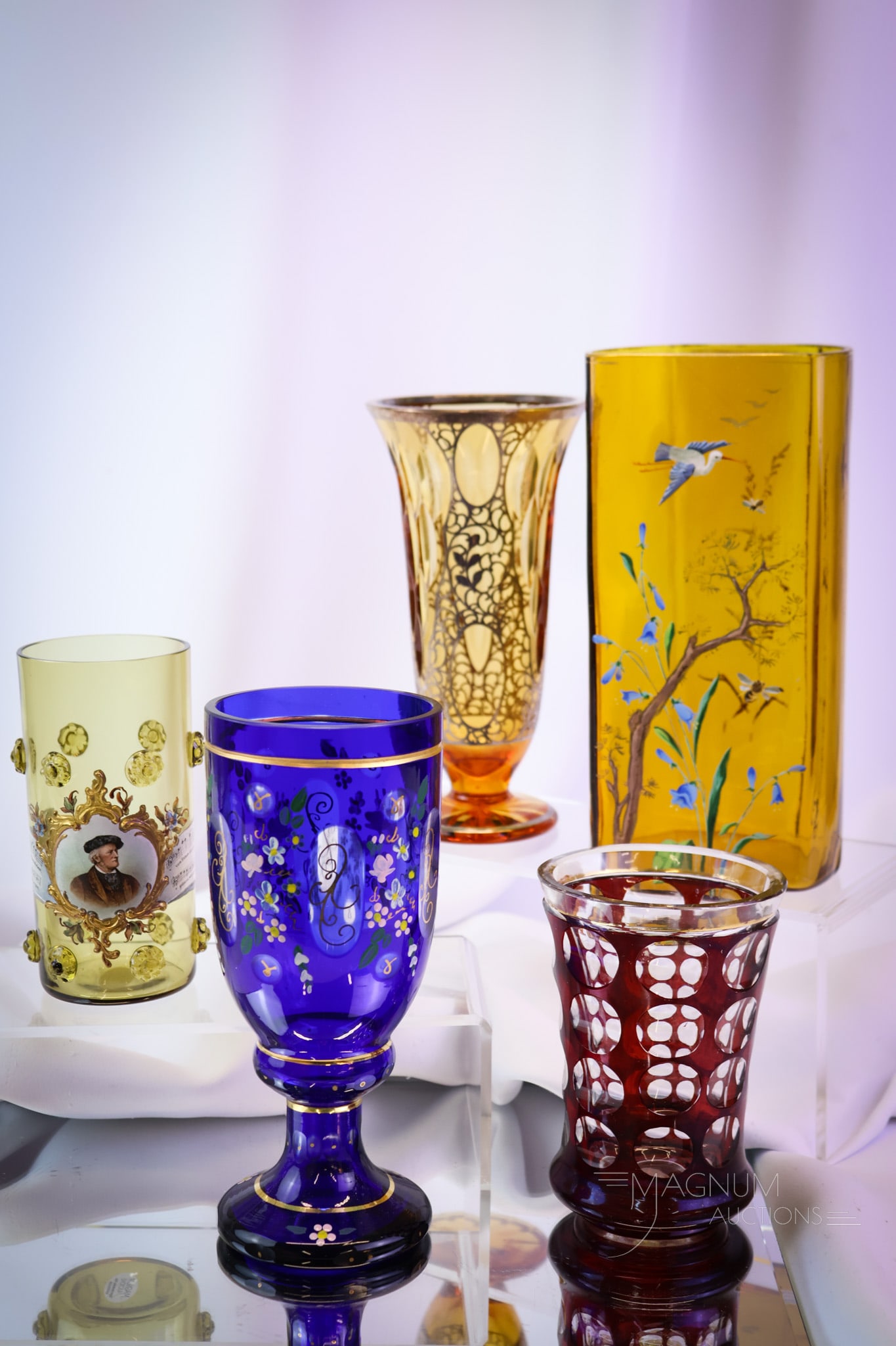 5 pc Lot Bohemian Glass Enameled & Silver Overlay: Five distinct finds in Victorian Bohemian glass. This lot includes enameled examples along with one silver overlay piece. The tallest measures 8". SHIPPING NOTICE: If you choose not to utilize the Liv