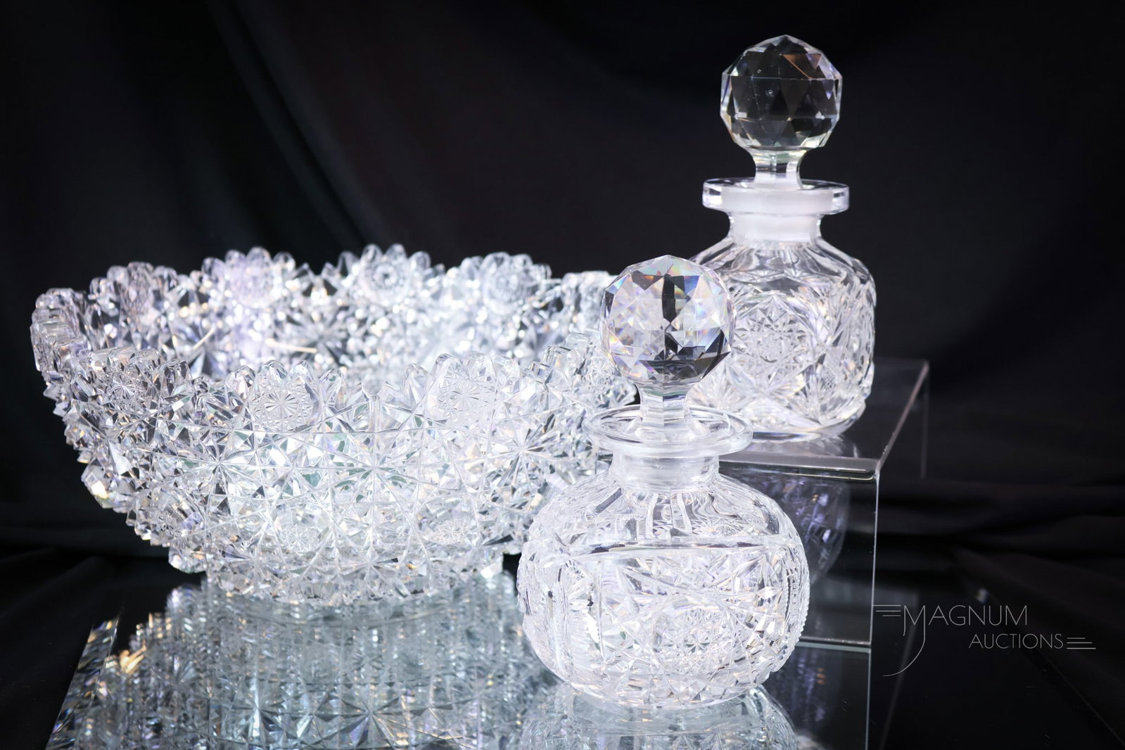 3 pc Lot American Brilliant Cut Glass Perfumes Egginton & More: Three beautiful finds in American brilliant cut glass. This lot offers a signed Eggington bowl along with two perfume/cologne bottles. The tallest of the offering measures 4 1/4" tall. The bowl is 9" 