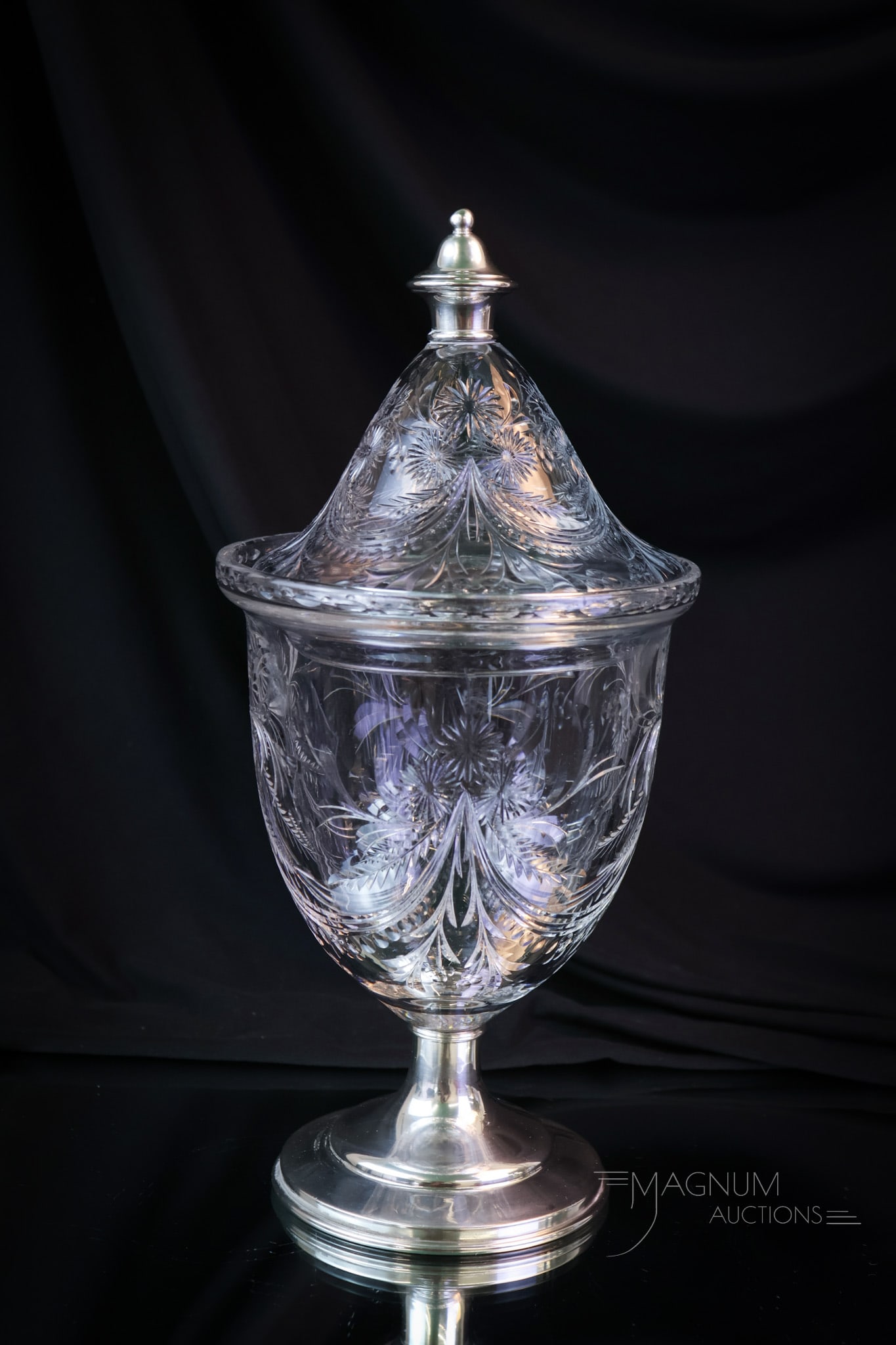 Hawkes American Brilliant Period Cut Glass & Sterling Silver Candy Jar: A fine American Brilliant Period cut-engraved glass with Sterling silver covered candy. This piece has a lovely floral swag engraving. This piece features a marked sterling finial and base. It measure