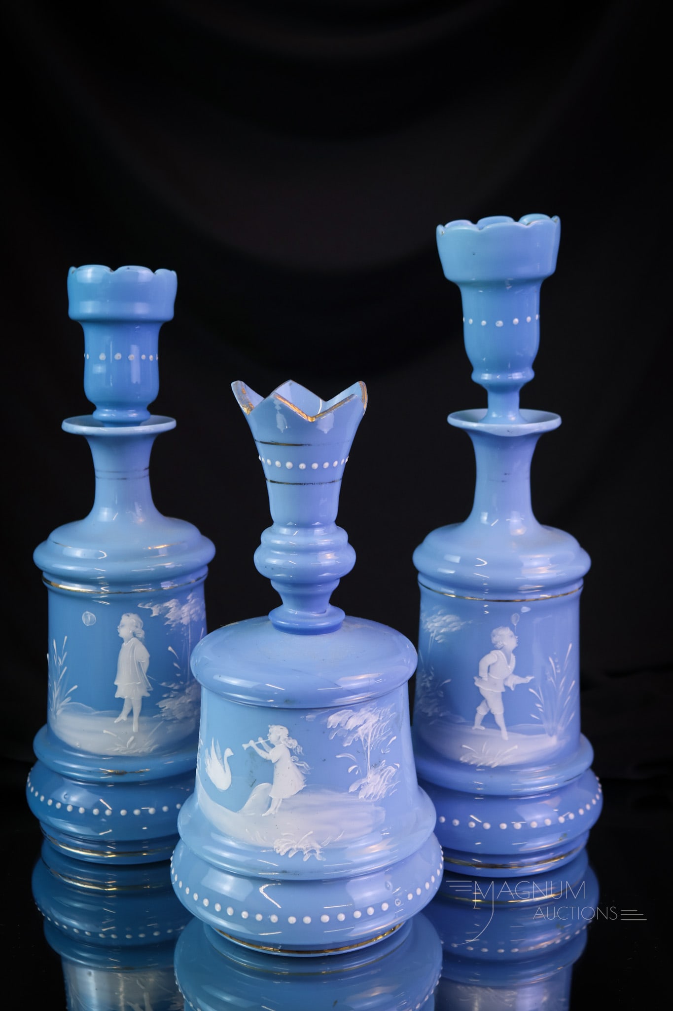 3 pc Set Victorian Blue Bristol Glass Dresser Vanity Set: An attractive and yet find in Victorian blue bristol glass. This set is decorated with Mary Gregory style decoration. Each of these vanity bottles has a nice blue stopper. The tallest of the set measu