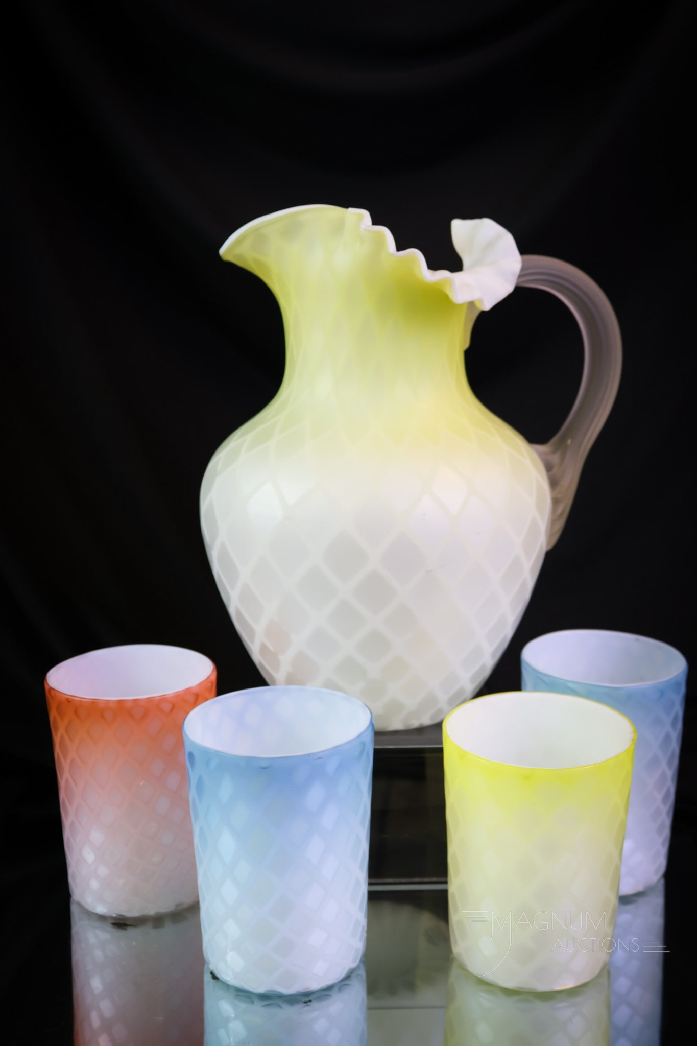 5 pc Set Victorian Lot Victorian Mother of Pearl Satin Glass: A colorful five-piece water set of Victorian mother-of-pearl satin glass. This set is made up of a yellow water pitcher and tumblers. There are two blue, one yellow, and lastly, one orange tumblers. T