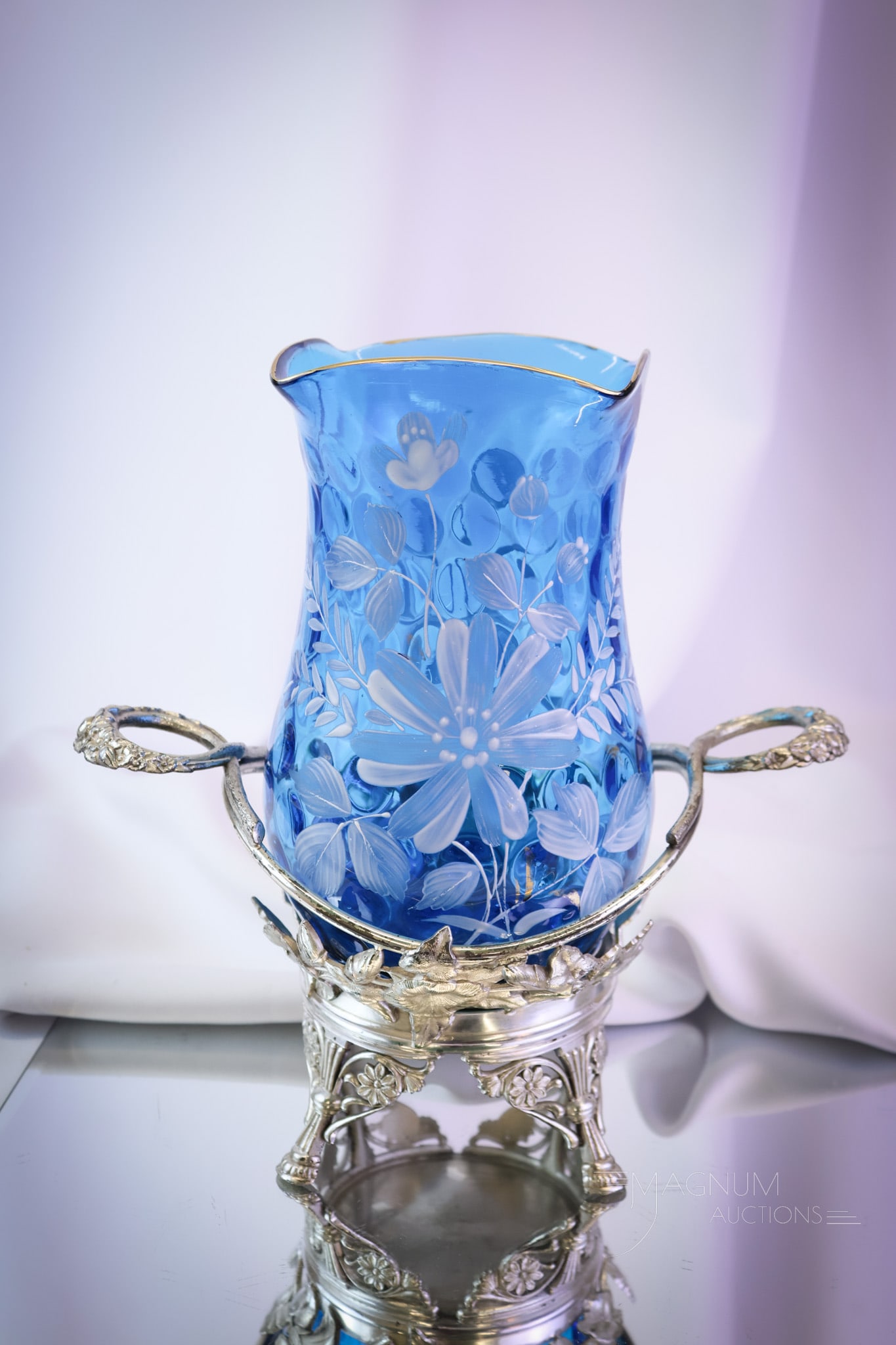 Hartford Victorian Silverplate Blue Enameled Glass Celery Vase Castor: A striking find in a Victorian celery castor. This vibrant blue celery vase is decorated with crisp white florals and gilt highlights. It resides in a signed Hartford Victorian silverplate holder. The