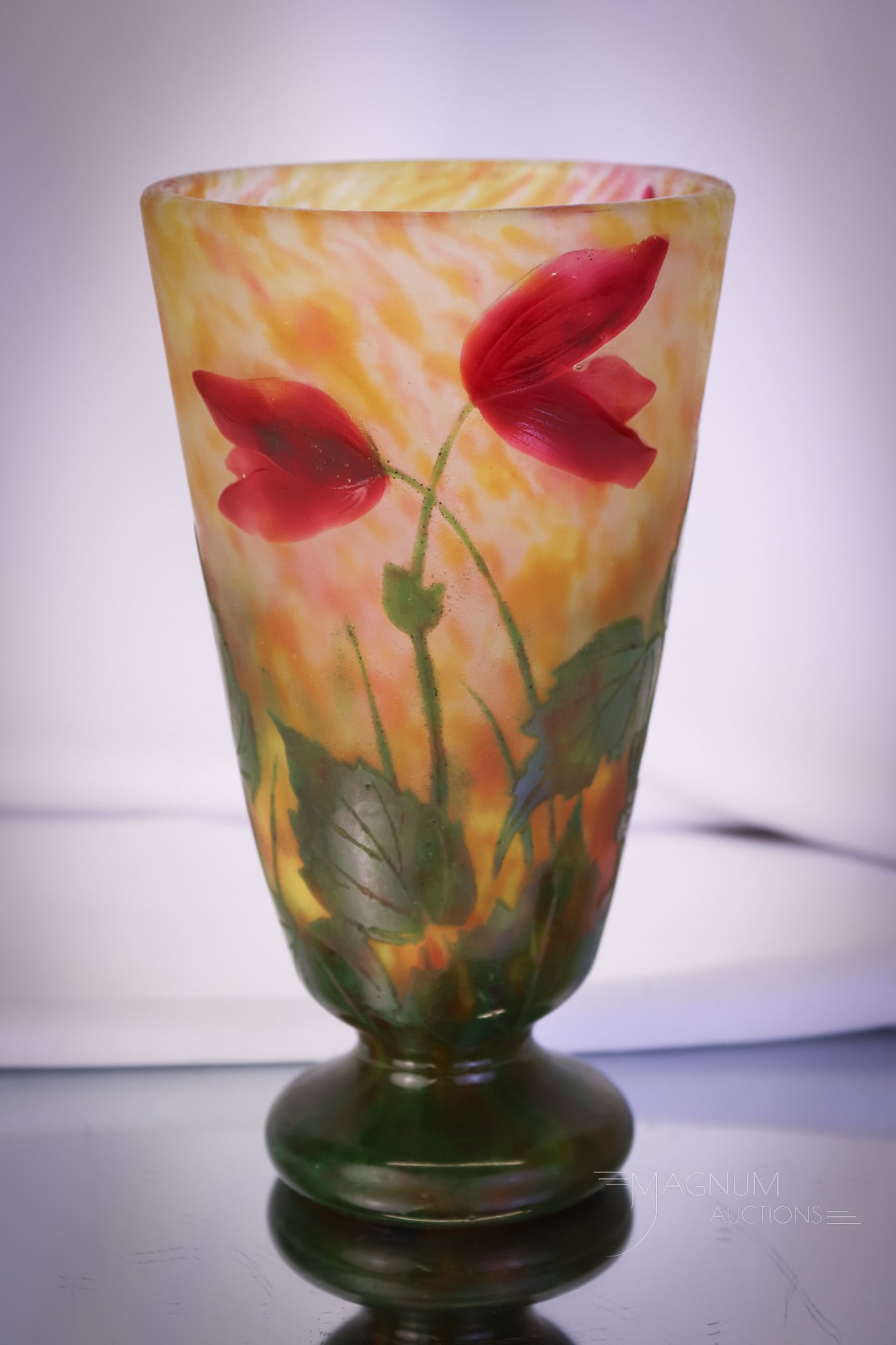 Daum Nancy Padded French Wheelcarved Red Poppies Cameo Glass Vase: A wonderful find in a piece of Daum Nancy French art glass. This is a padded wheel-carved vase. Vivid red poppies are applied or padded and wheel-carved. These poppy flowers, along with dark green fol