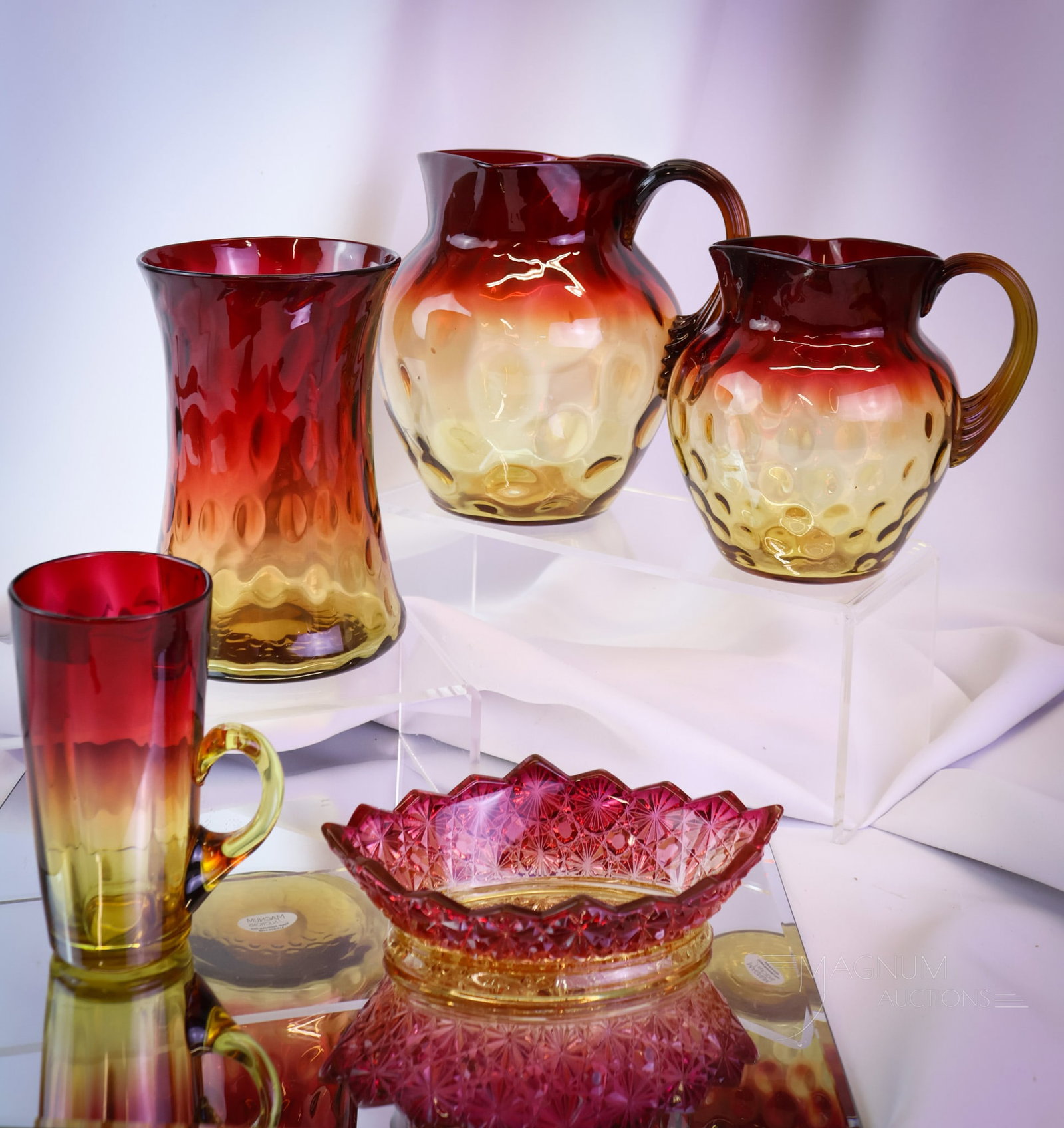 5 pc Lot Victorian Amberina Glass Mt. Washington New England Hobbs & More: Five superb finds in Victorian amberina glass. This lot offers examples by Mt. Washington, New England Glass, and Hobbs. The tallest measures 6 1/2". There is a water pitcher, a milk pitcher. A celery