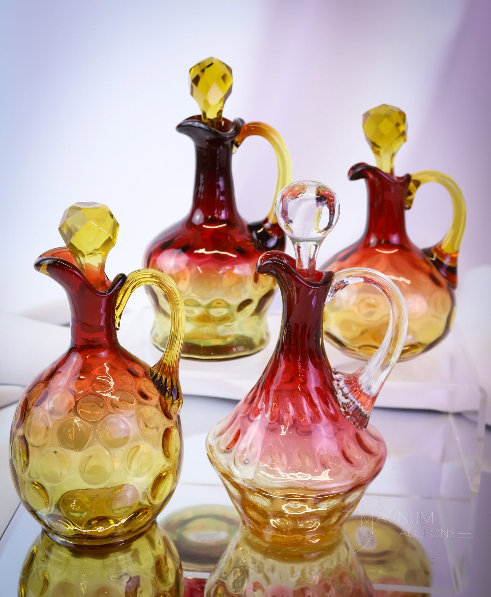 4 pc Lot Victorian Mt. Washington Hobbs & More Amberina Glass Cruets: Four divine pieces of Victorian amberina glass for your bidding pleasure. This lot includes an array of shapes and sizes of cruets. Each has perfect coloring. The tallest measures 7". SHIPPING NOTICE: