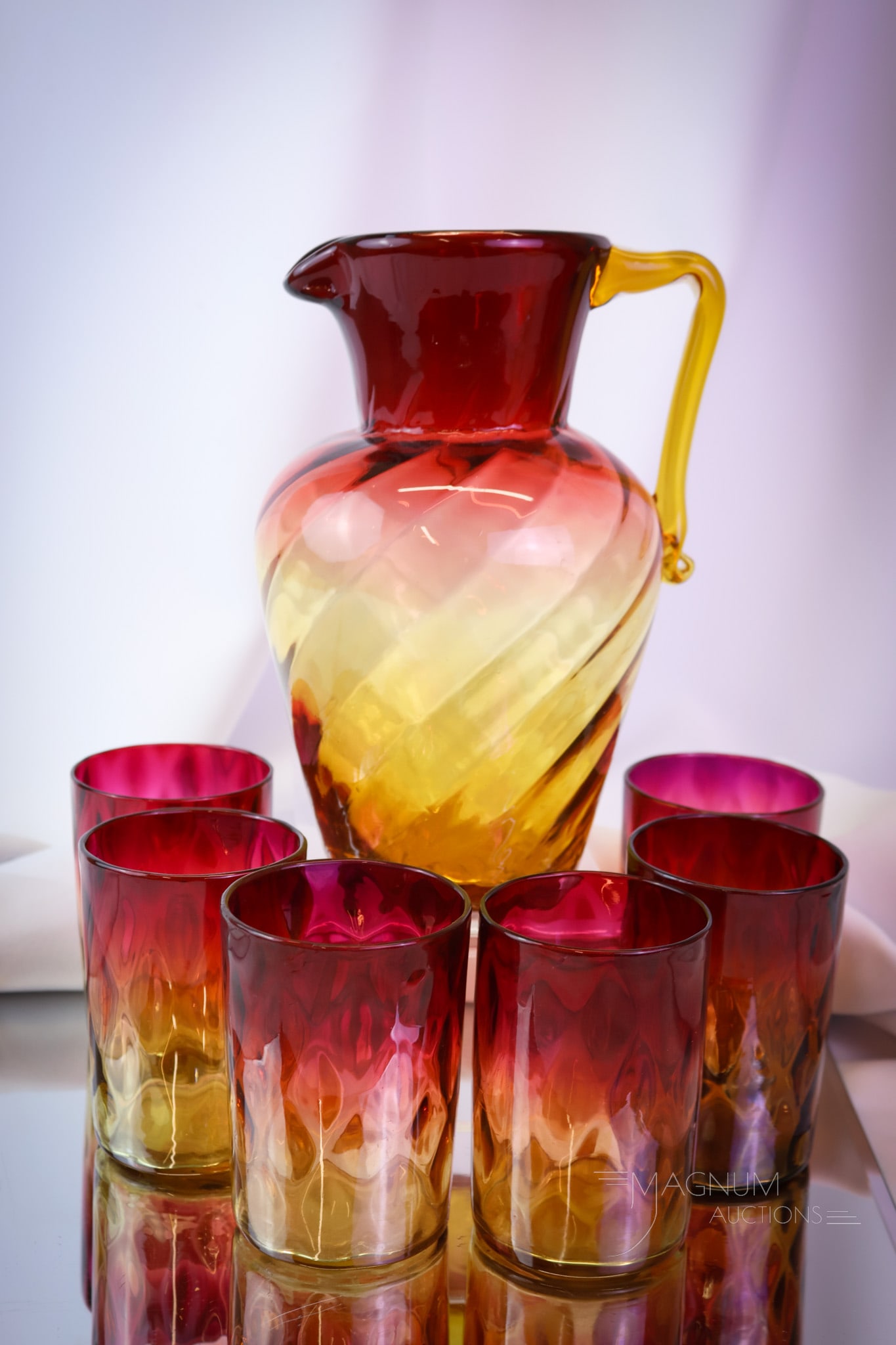 7 pc Lot Victorian Amberina Glass Pitcher & Tumblers: A beautiful amberina colored offering of Victorian glass. This lot offers a Swirl pattern water pitcher and a set of six Mt. Washington amberina tumblers. Each has great coloring! SHIPPING NOTICE: If 