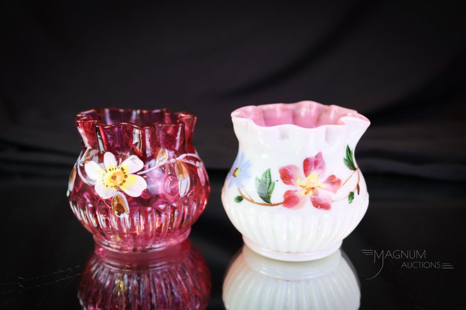2 pc Lot Victorian Pleated Glass Toothpick Holders: Two desirable finds in Victorian glass toothpick holders. One in cranberry and one in a pink-cased glass. Both are enamel-decorated with flowers. The pink-cased example is rich in uranium content and
