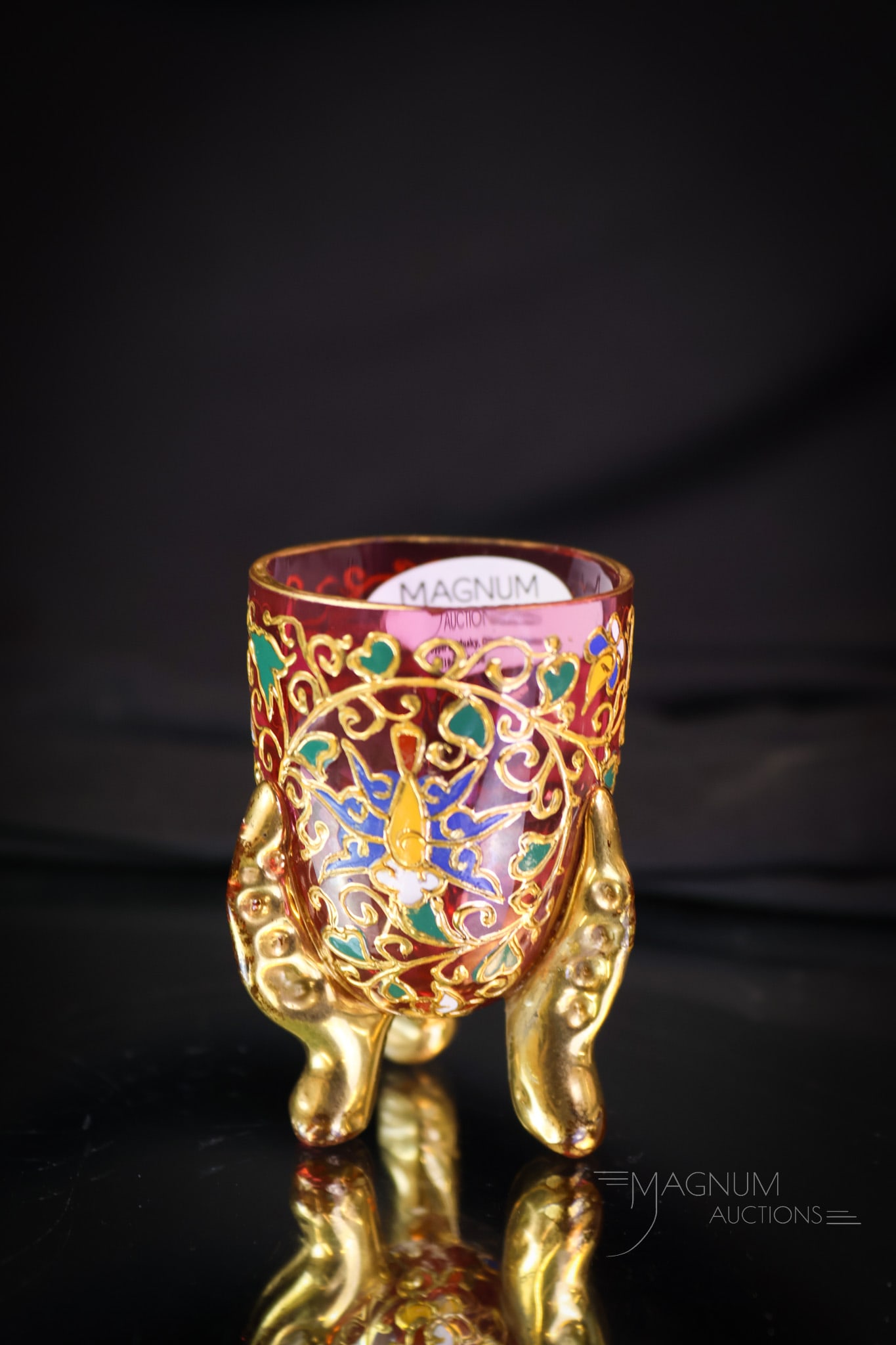 Rare Moser Victorian Footed Bug Enameled Glass Toothpick Holder: A rare find in Victorian Moser glass. This is a cranberry gilt and enameled toothpick holder. This piece has three applied glass feet and is covered in gold. The toothpick holder has three bugs in the