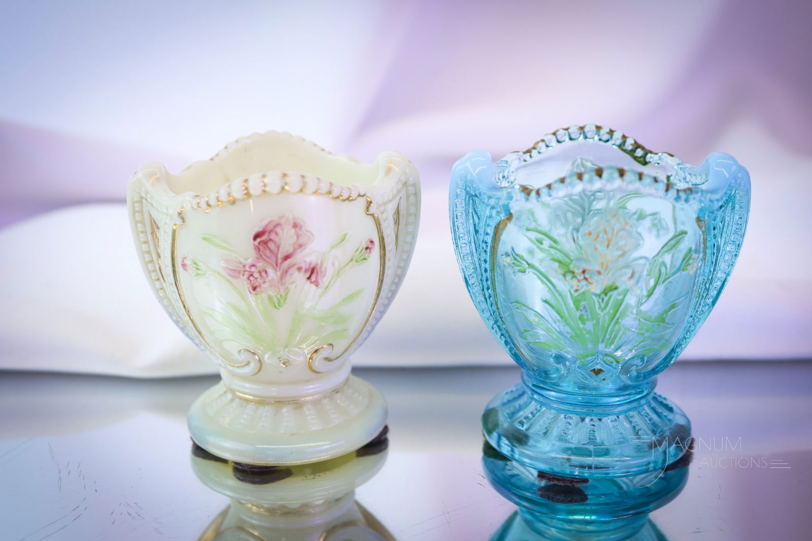 2 pc Lot Northwood Wild Bouquet Victorian Glass Toothpick Holders: Two fine examples of Victorian Northwood Wild Bouquet pattern toothpick holders. One in blue opalescent decorated glass. One in uranium-rich custard glass. Each measures 2 1/2" tall. SHIPPING NOTICE: