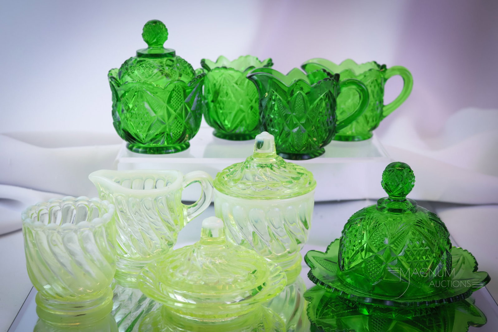 9 pc Lot Victorian Children's Glass Vaseline Albany Opalescent & U.S. Glass: A generous offering of two Victorian children's table sets and a little more. The first is an Albany glass vaseline opalescent Twist pattern table set. The second is a green Pennsylvania U.S. Glass ta