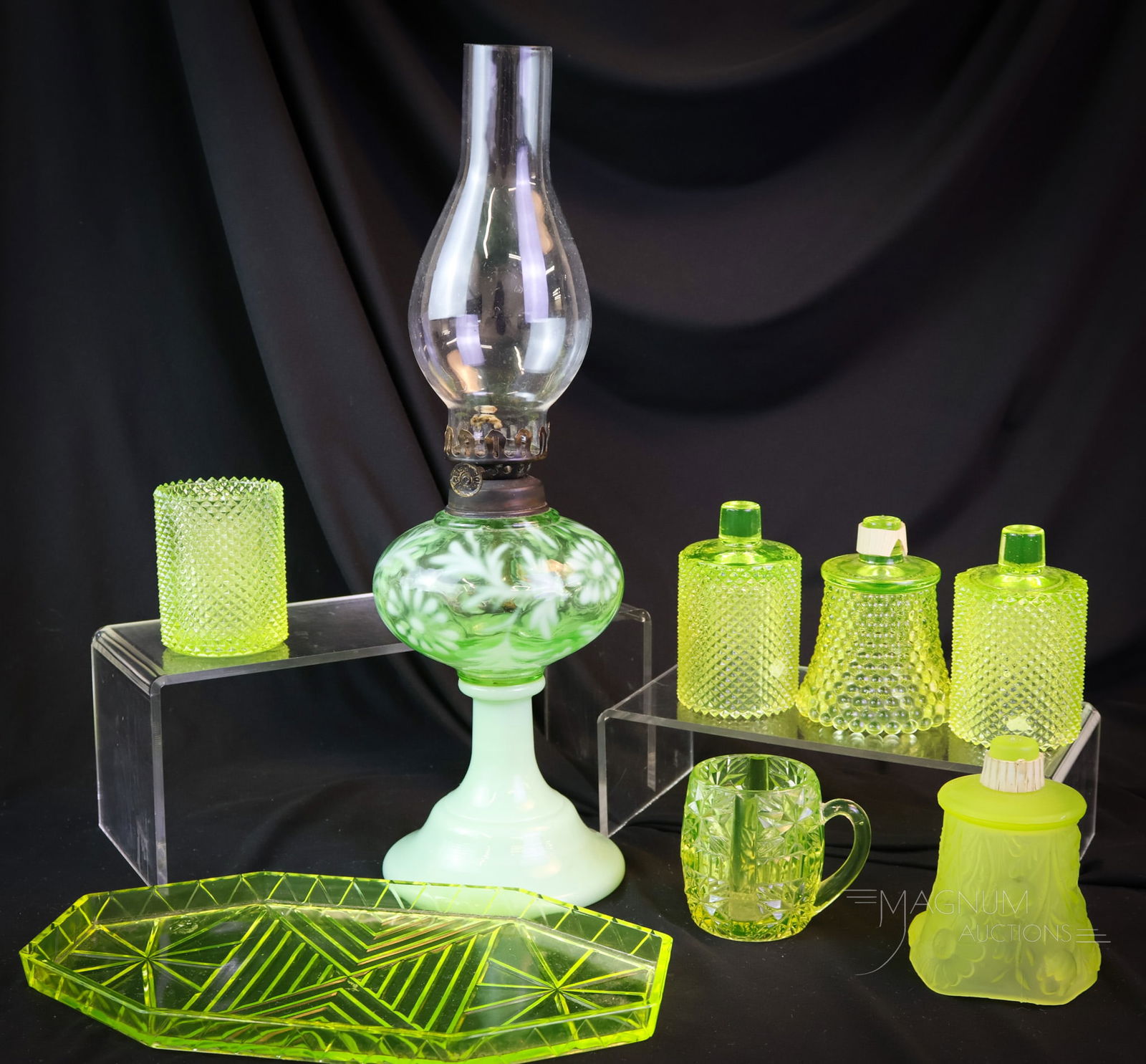 8 pc Lot Uranium Vaseline Glass & More: A plentiful lot of eight pieces of uranium-rich glass for your bidding pleasure. This lot also includes a piece of Mosser Jadeite and green opalescent Daisy and Fern in the form of an oil lamp. The ta