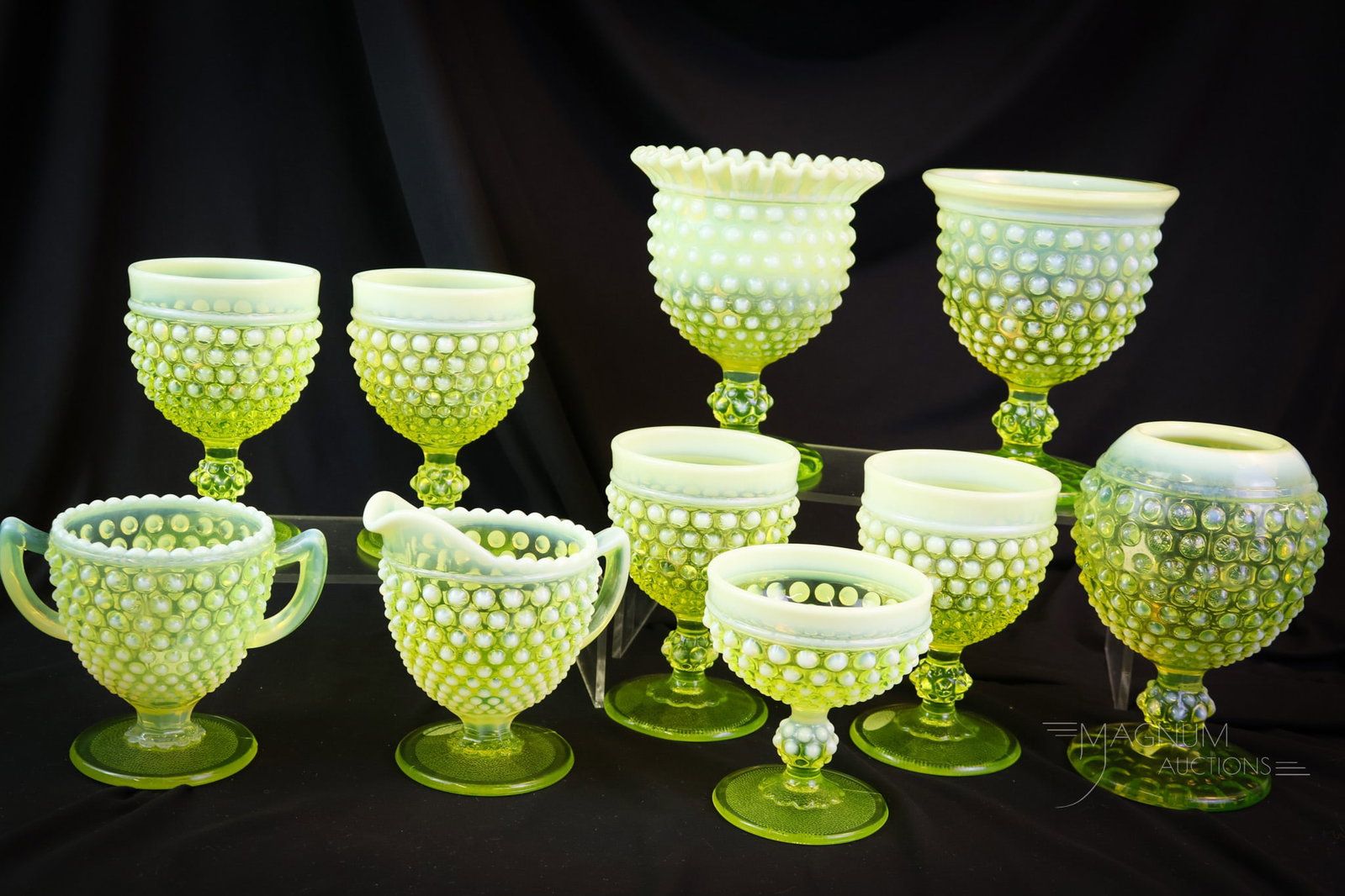 10 pc Lot Imperial Vaseline Uranium Opalescent Hobnail: Ten glowing finds in Imperial vaseline uranium-rich opalescent Hobnail pattern. This is a lot the Vasies will be talking about for days. How do they do it at Magnum Auctions? Can you believe all of th