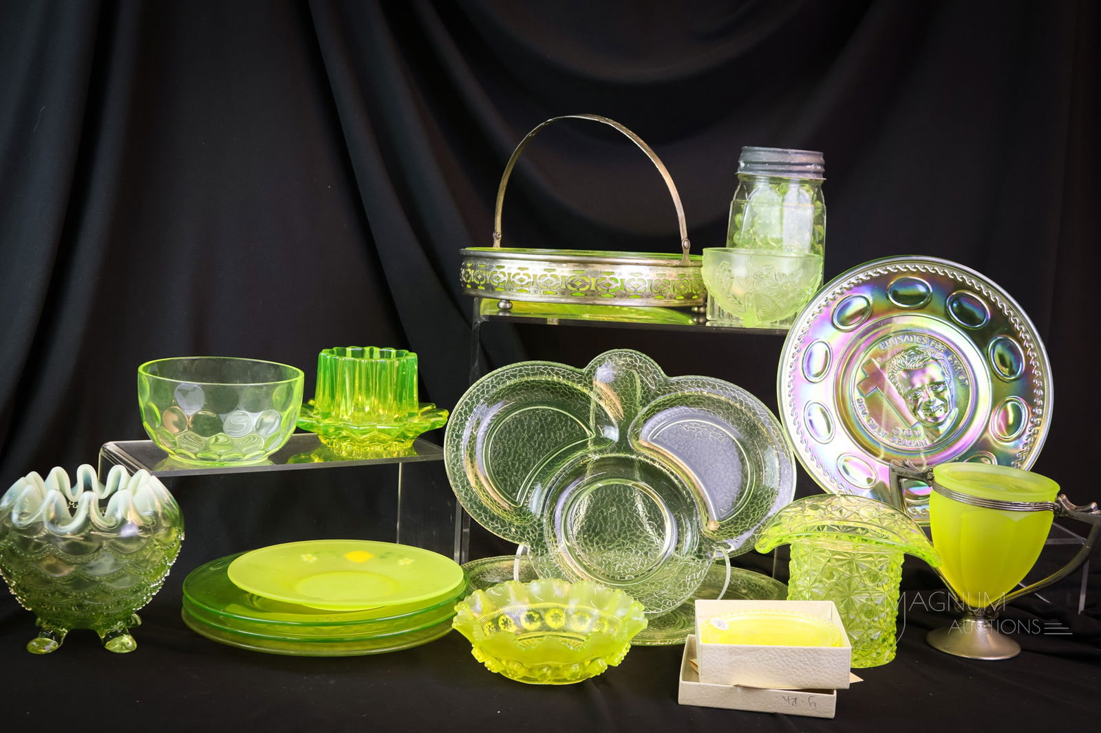17 pc Lot Uranium Vaseline Glass Shiners: This lot of seventeen pieces is ever-glowing in rich uranium content. There are five plates, three bowls, a divided relish, a sugar and more in this black light loving lot. The tallest measures 5 1/2"