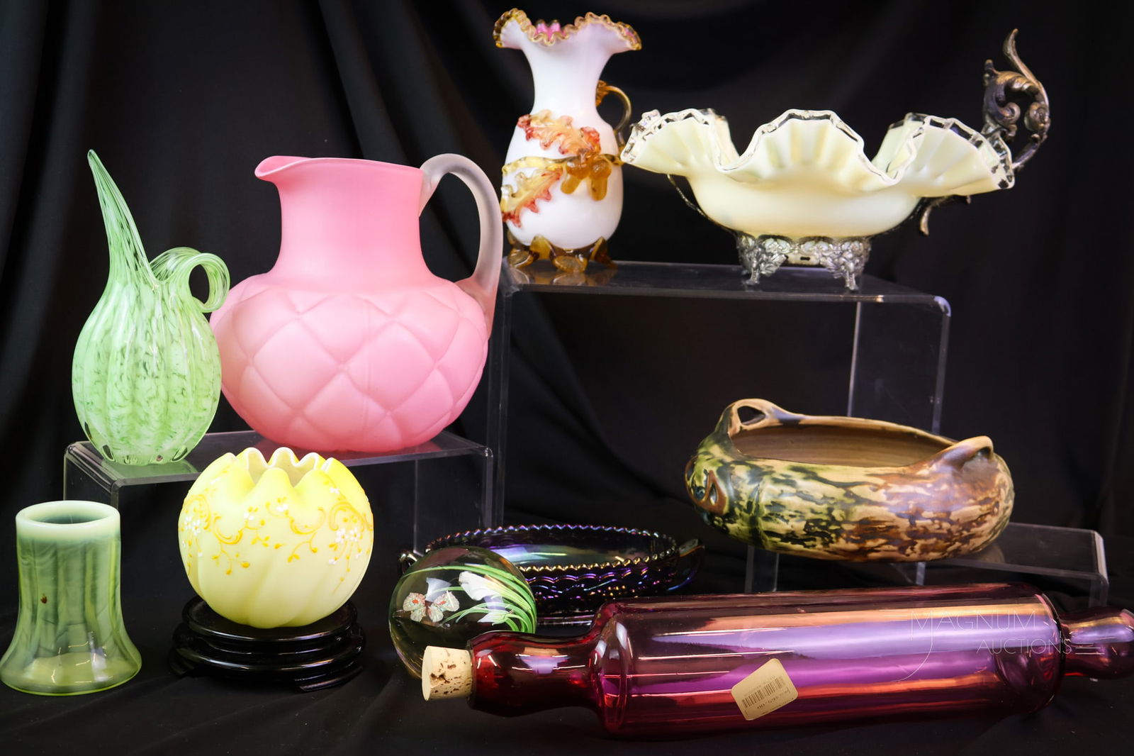 11 pc Lot Eclectic Pleasures: This lot offers eleven eclectic finds in collectible glass and more. There's a cranberry glass rolling pin. Fenton glass. Vaseline nd uranium art glass. Even a Roseville bowl. All of this and so much